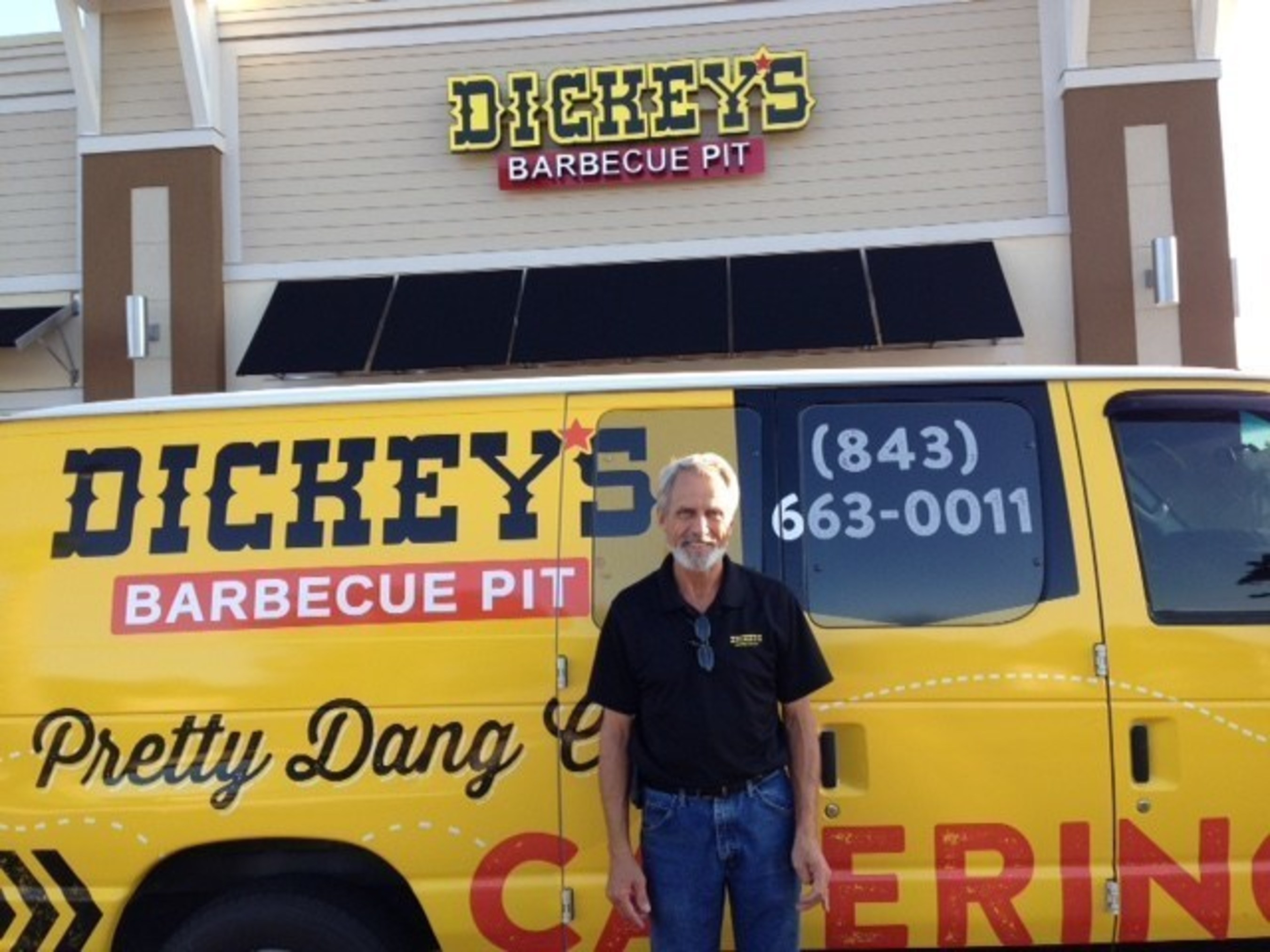 Owner/Operator Dennis Farmer poses in front of the newest Dickey's Barbecue Pit in North Myrtle Beach, opening Thursday.