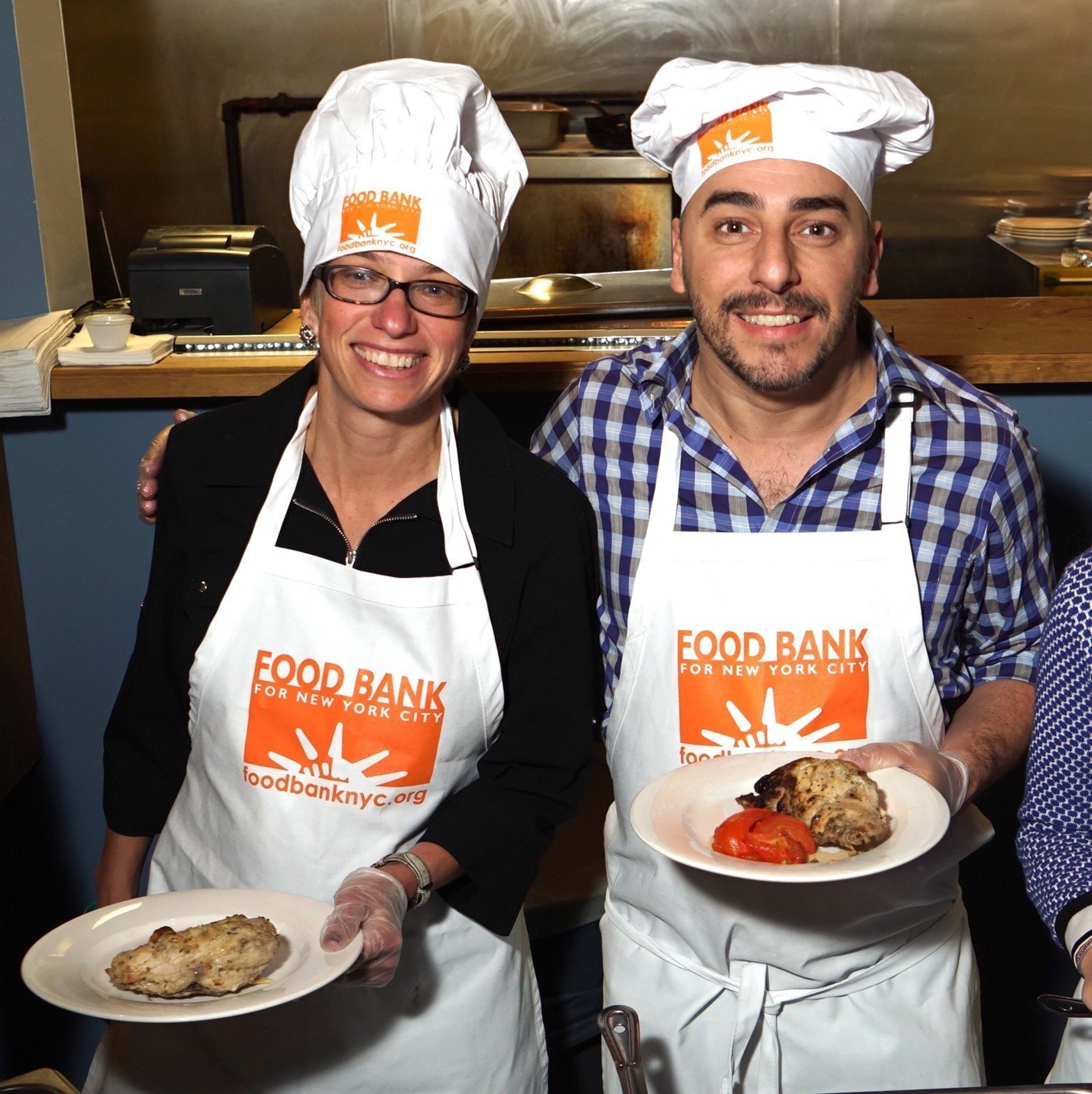 BBVA Compass ‎Chief Marketing and Client Experience Officer Jennifer Dominiquini and Chef Jordi prepare to serve 100 seniors at Food Bank for New York's West Harlem Community Kitchen.