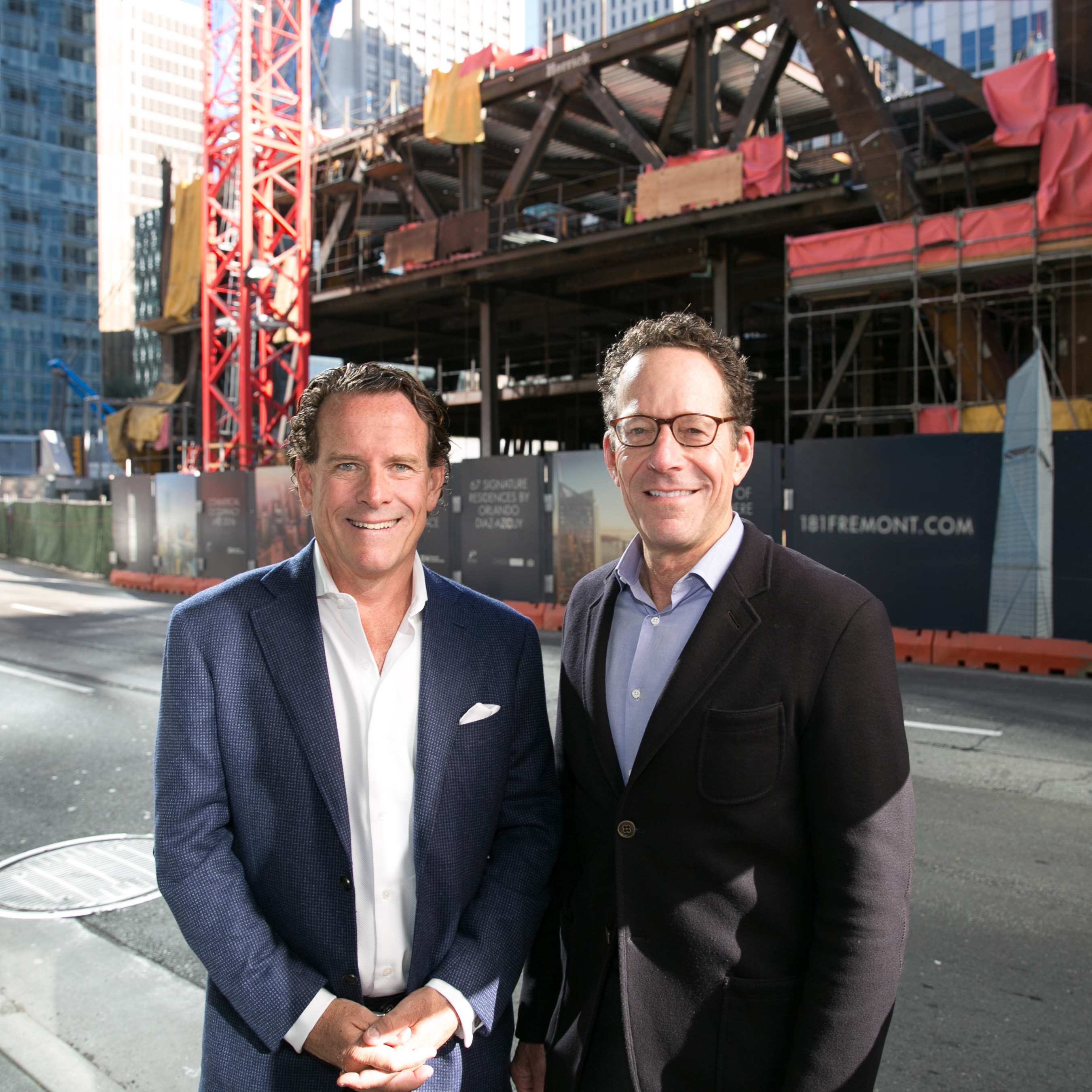 Pacific Union CEO Mark A. McLaughlin and The Mark Company President, Alan Mark in front of 181 Fremont in San Francisco.
