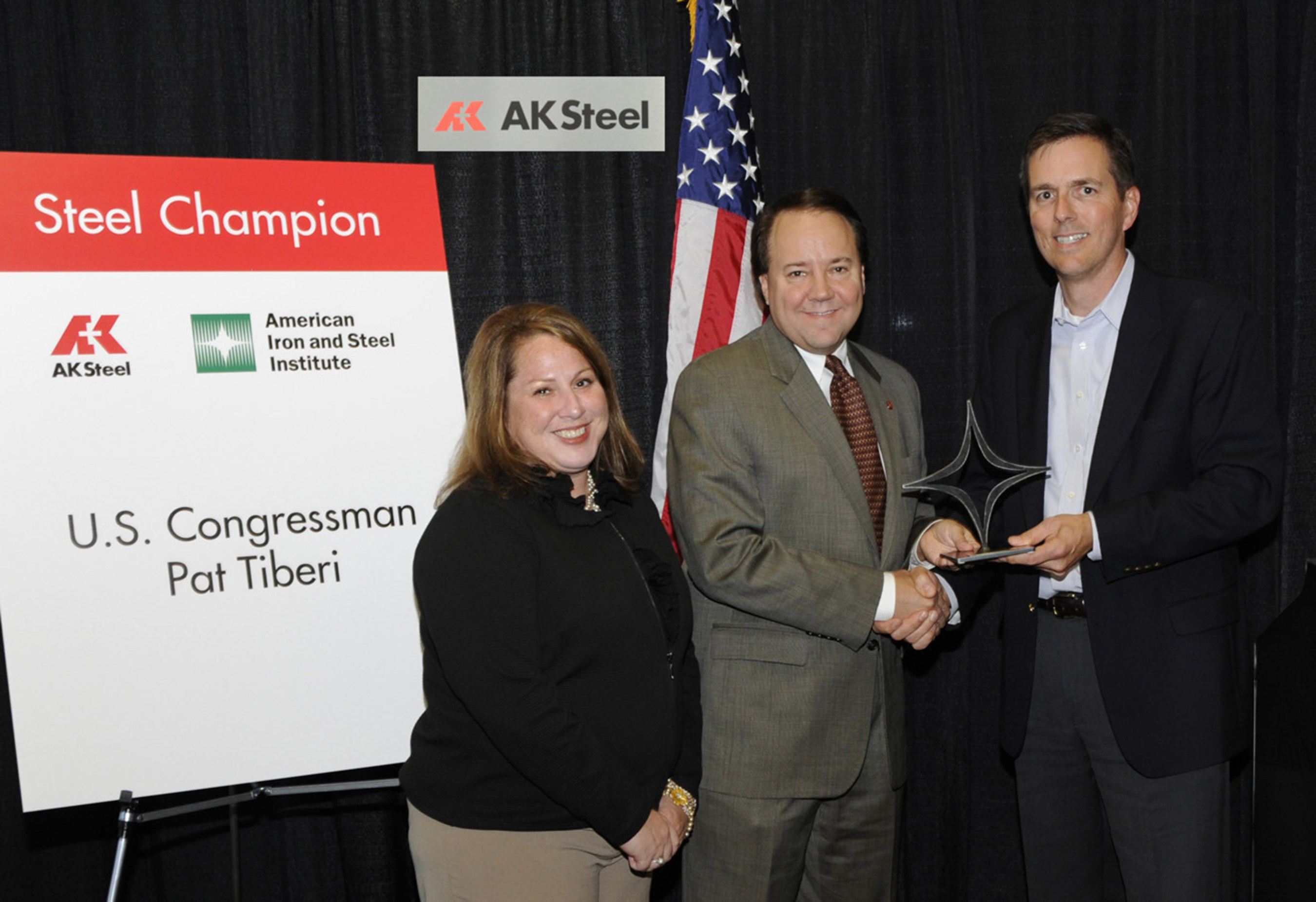 United States Congressman Pat Tiberi of Ohio is presented with a "Steel Champion" Award from the American Iron and Steel Institute (AISI) at AK Steel's Zanesville, Ohio Works. Left to right, Beth DeBrosse, Senior Director, Government Relations, AISI, Congressman Pat Tiberi and Roger Newport, Executive Vice President, Finance and Chief Financial Officer.
