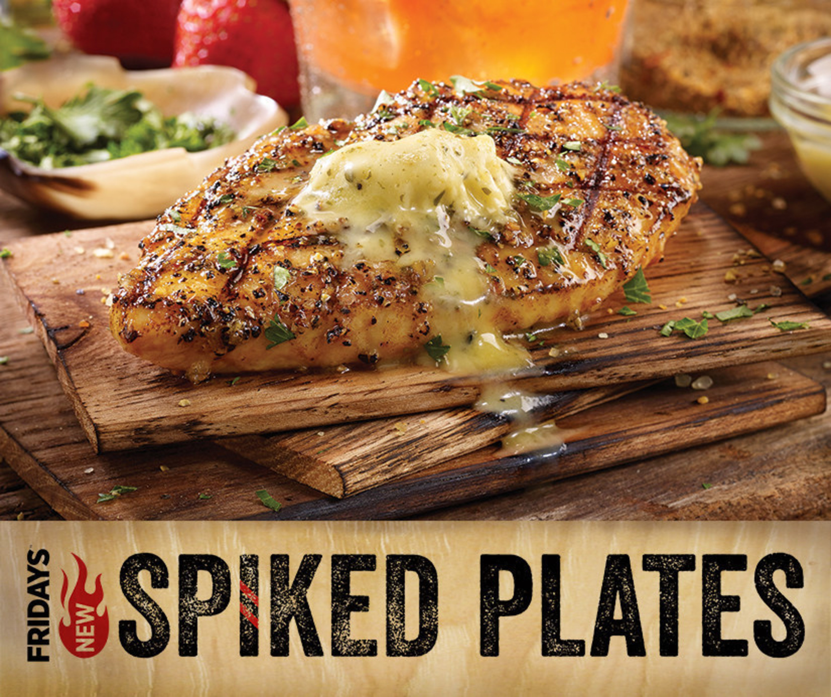TGI Fridays' chefs are taking over, raiding the bar for inspiration and combining what Fridays does best-food and spirits. Pictured is the new Bourbon Barrel Chicken, all-natural chicken fire-grilled and served over bourbon-infused wood planks.