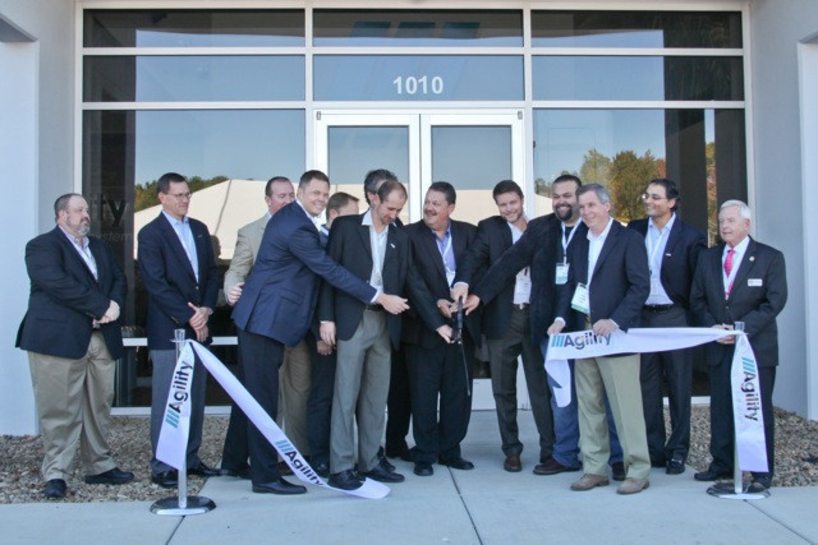 Agility executives, Board of Director members and company founders cut the ribbon that officially opens the new Salisbury, North Carolina facility
