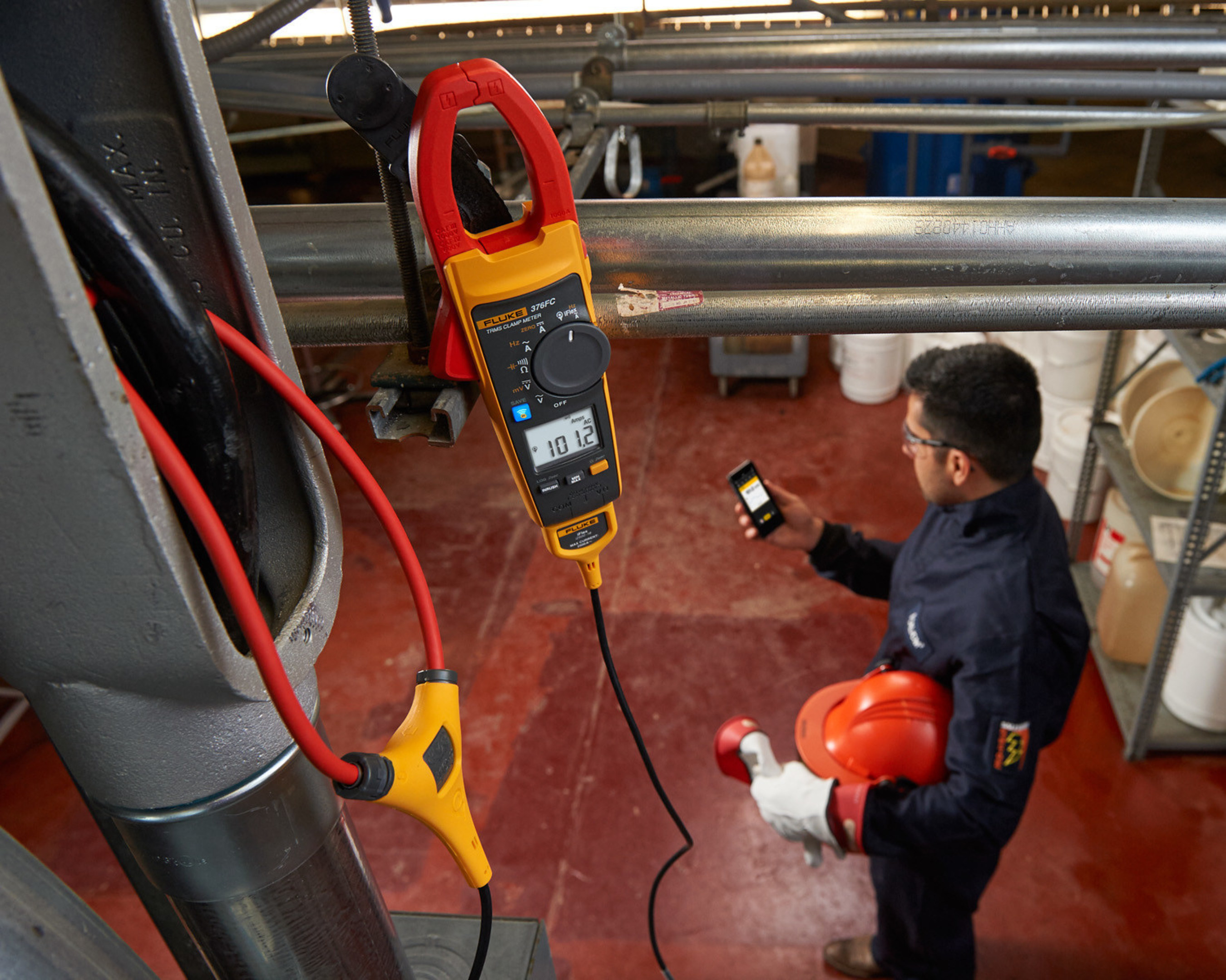 The new Fluke Connect-enabled 370 FC Series Clamp Meters log measurements to pinpoint intermittent faults precisely without the need for the technician to be present. Those measurements are then wirelessly transmitted to the Fluke Connect app on smartphones or tablets and automatically uploaded to the cloud, keeping technicians outside the arc flash zone and away from dangerous moving machinery, improving safety.