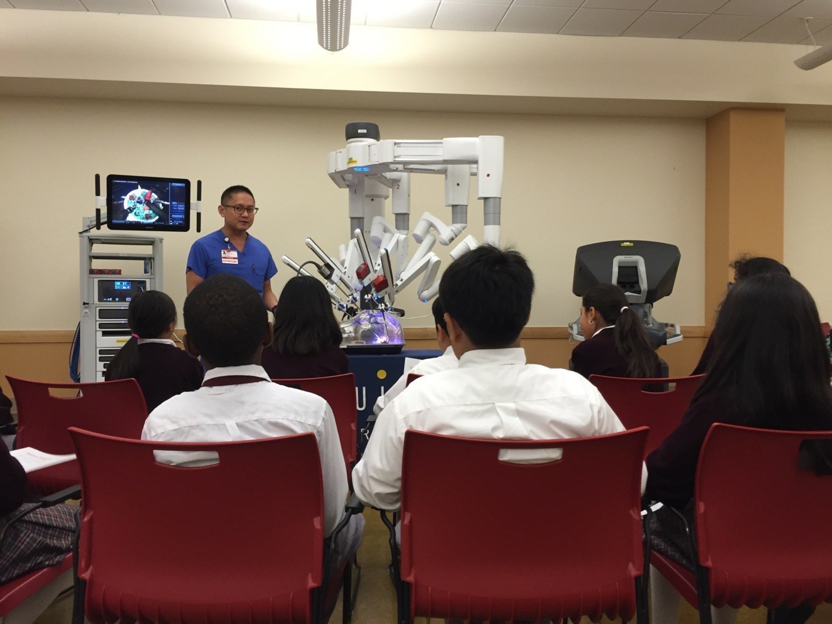 Dr. David Duong from Saint Francis Memorial Hospital shows the daVinci Robotic Surgical System to students at De Marillac Academy in San Francisco.