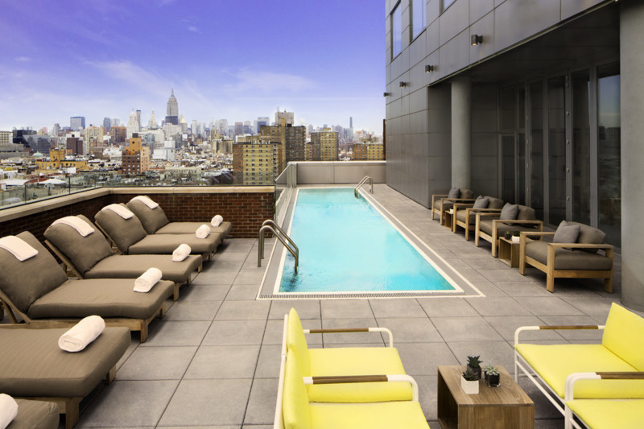 The impressive 5,000 sq. ft. terrace located on the west side of the 15th floor offers breathtaking views of Manhattan and is outfitted with its own swimming pool, bar and a variety of seating options - providing the perfect backdrop to enjoy locally crafted cocktails from the hotel's rooftop bar & restaurant, Mr. Purple.