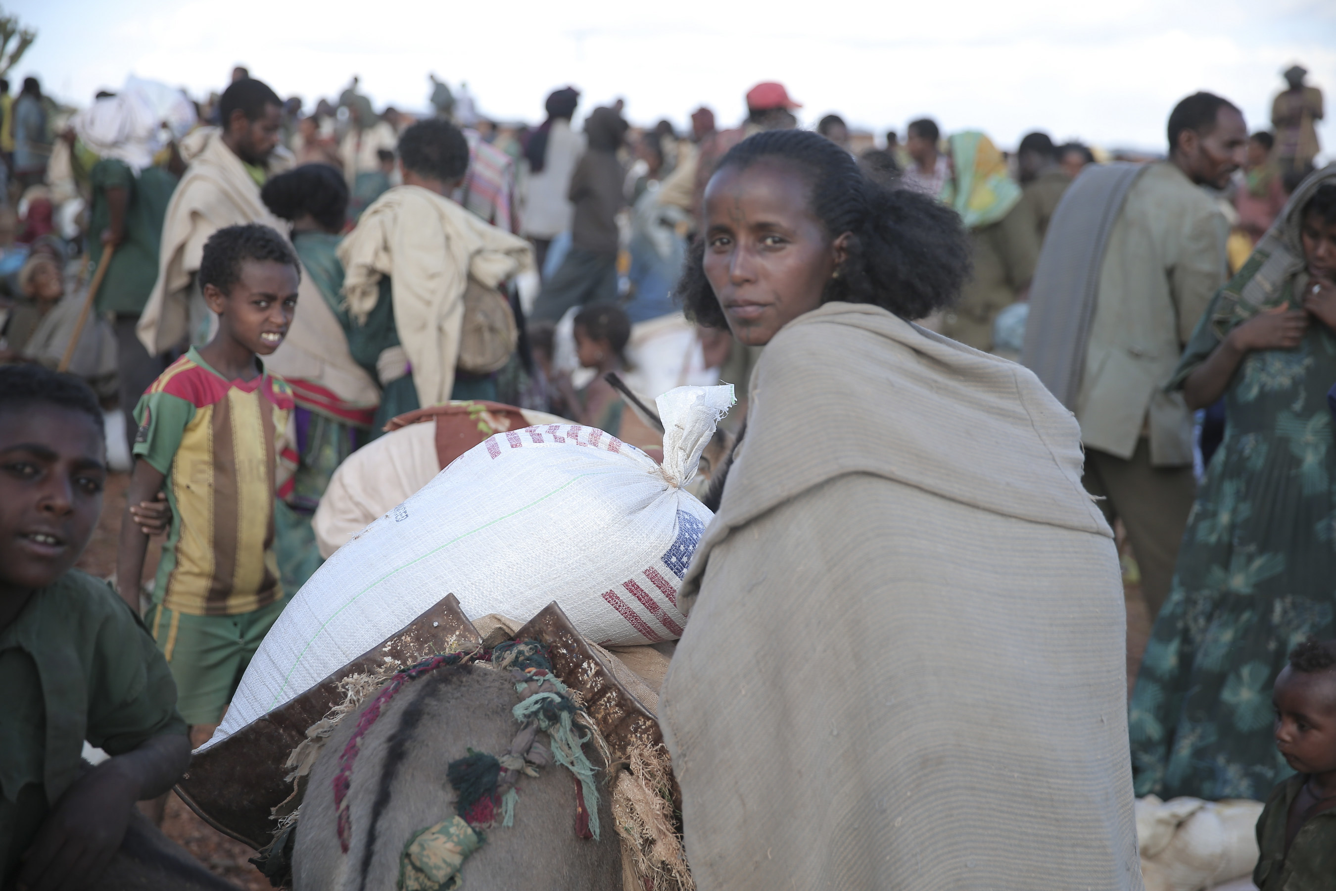 An emergency food aid distribution in the Amhara Region of Ethiopia. Save the Children, in partnership with the Organization for Rehabilitation and Development in Amhara (ORDA), is leading the distribution of the food aid for this site.