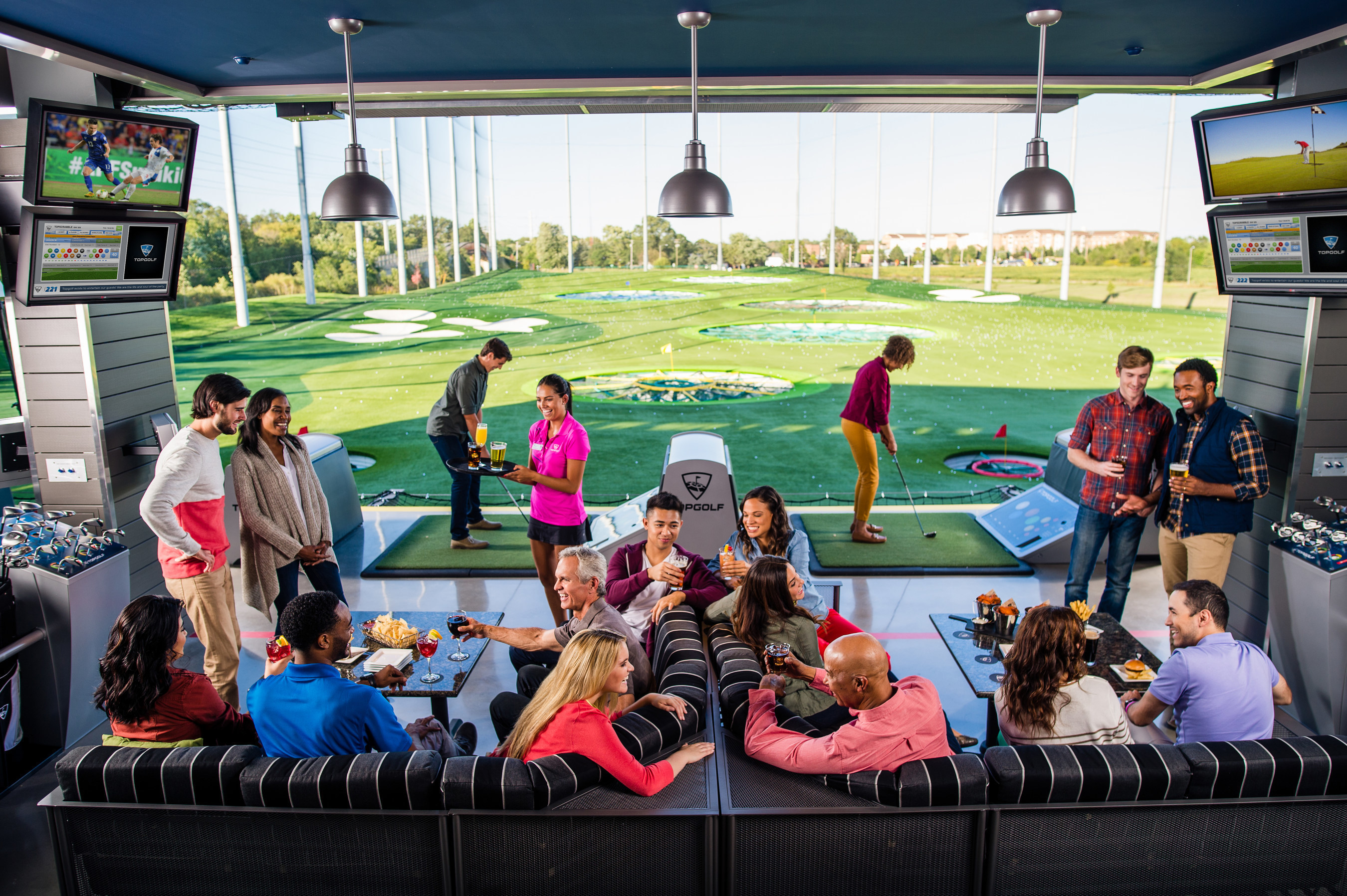 Guests playing Topgolf in Naperville, IL (PRNewsFoto/Topgolf)