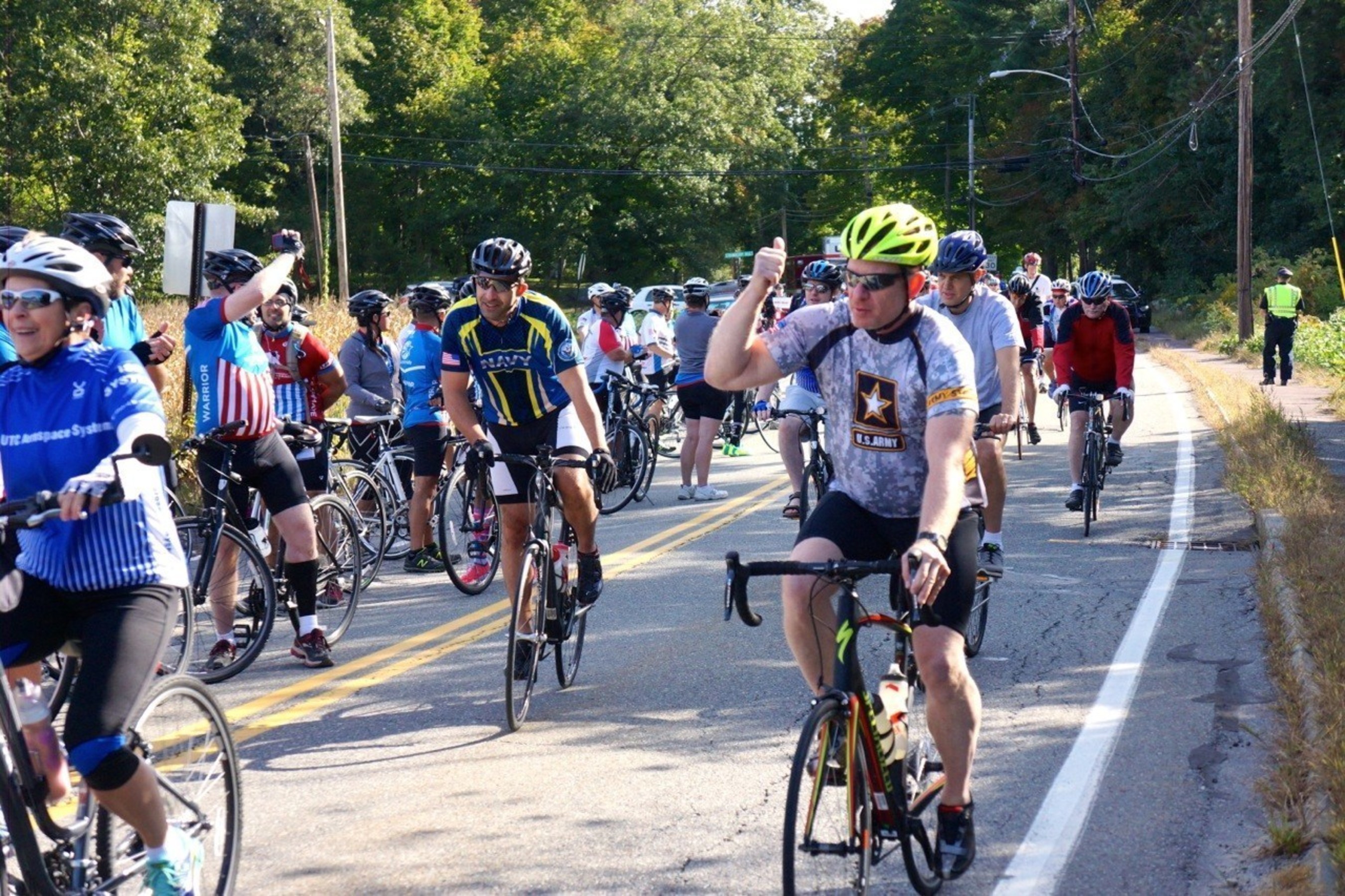 WWP supporters wave as they participate in a Soldier Ride Community Ride event.