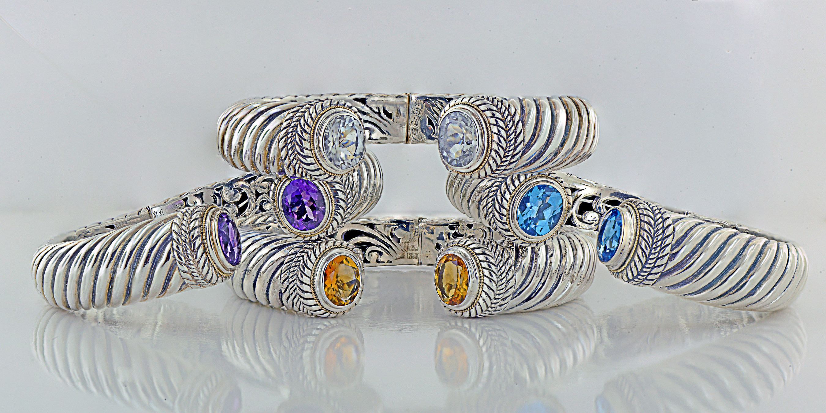 Perfect for Mother's Day. Handcrafted Sterling Silver and Gemstone bangles by Robert Manse Designs. Amethyst and Citrine bangles boast over 5 carats of gemstones. Blue Topaz and White Topaz have over 8 carats of top quality gemstones.