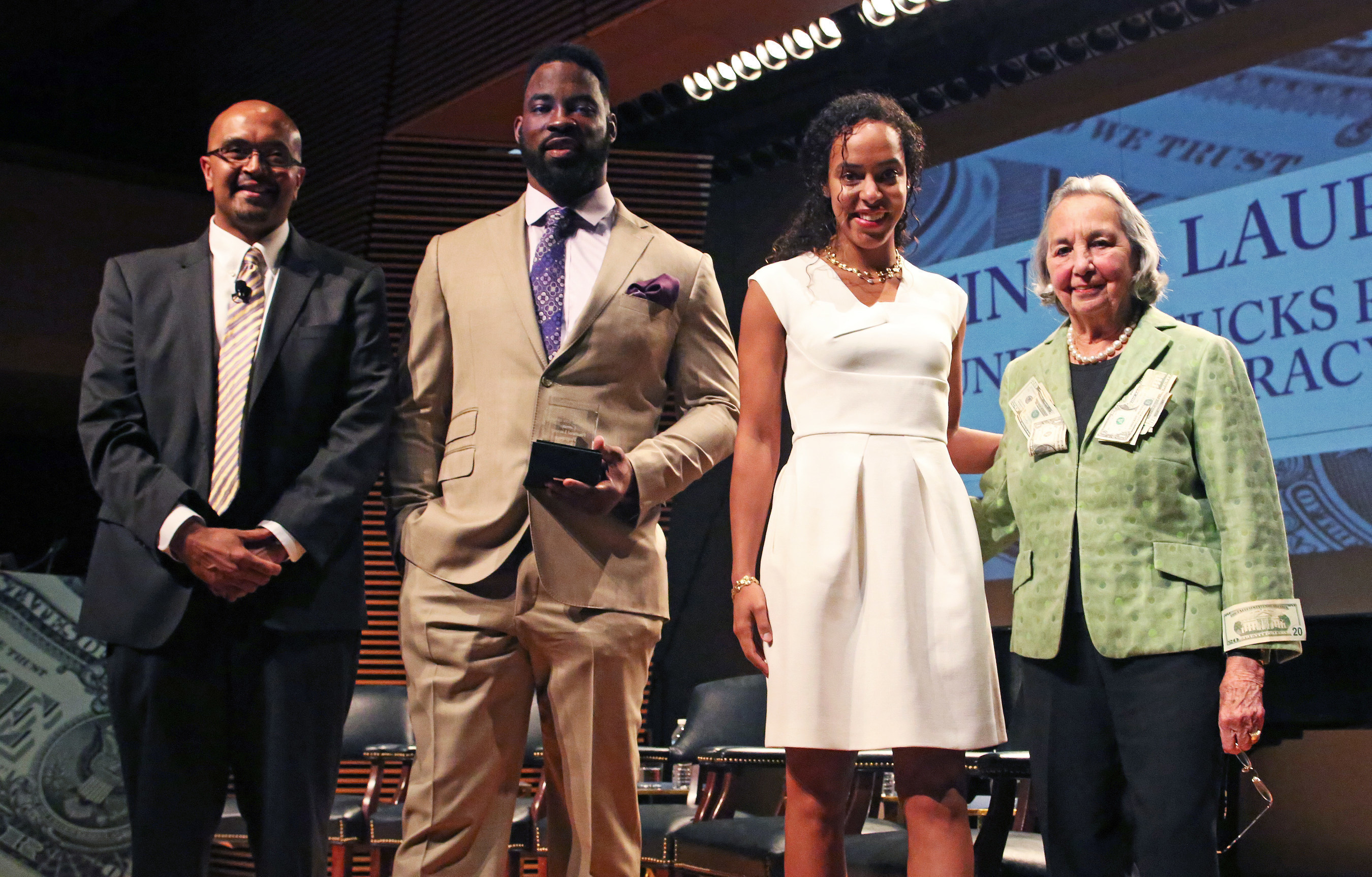 Teachers College, Columbia University honored former NY Giants Defensive End Justin Tuck and his wife Lauran Tuck, who also gave the keynote address during an event highlighting its Cowin Financial Literacy Program on April 21. Pictured (l.-r.): Cowin program faculty director and Teachers College professor Anand Marri, Justin Tuck, Lauran Tuck, Teachers College trustee and program founder Joyce B. Cowin.