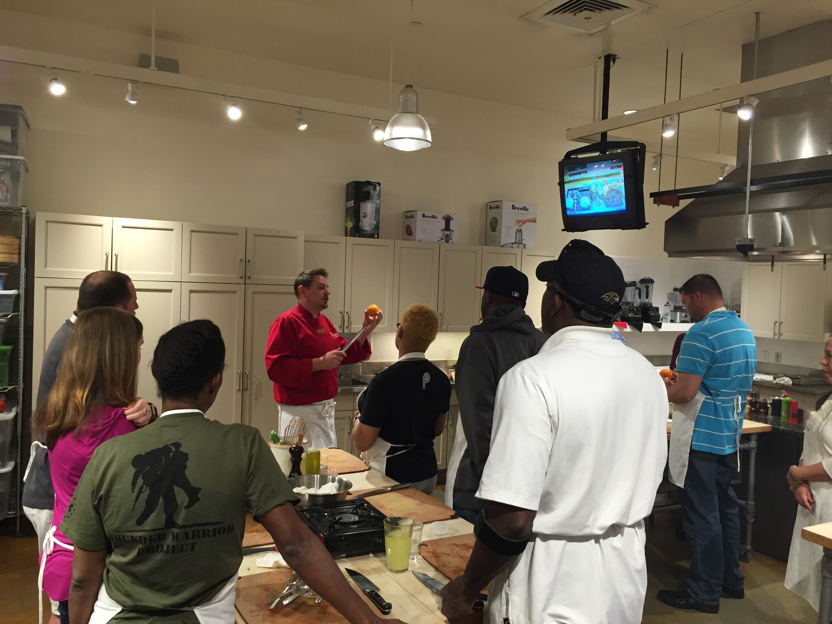 Wounded veterans and their guests learn Greek culinary skills.