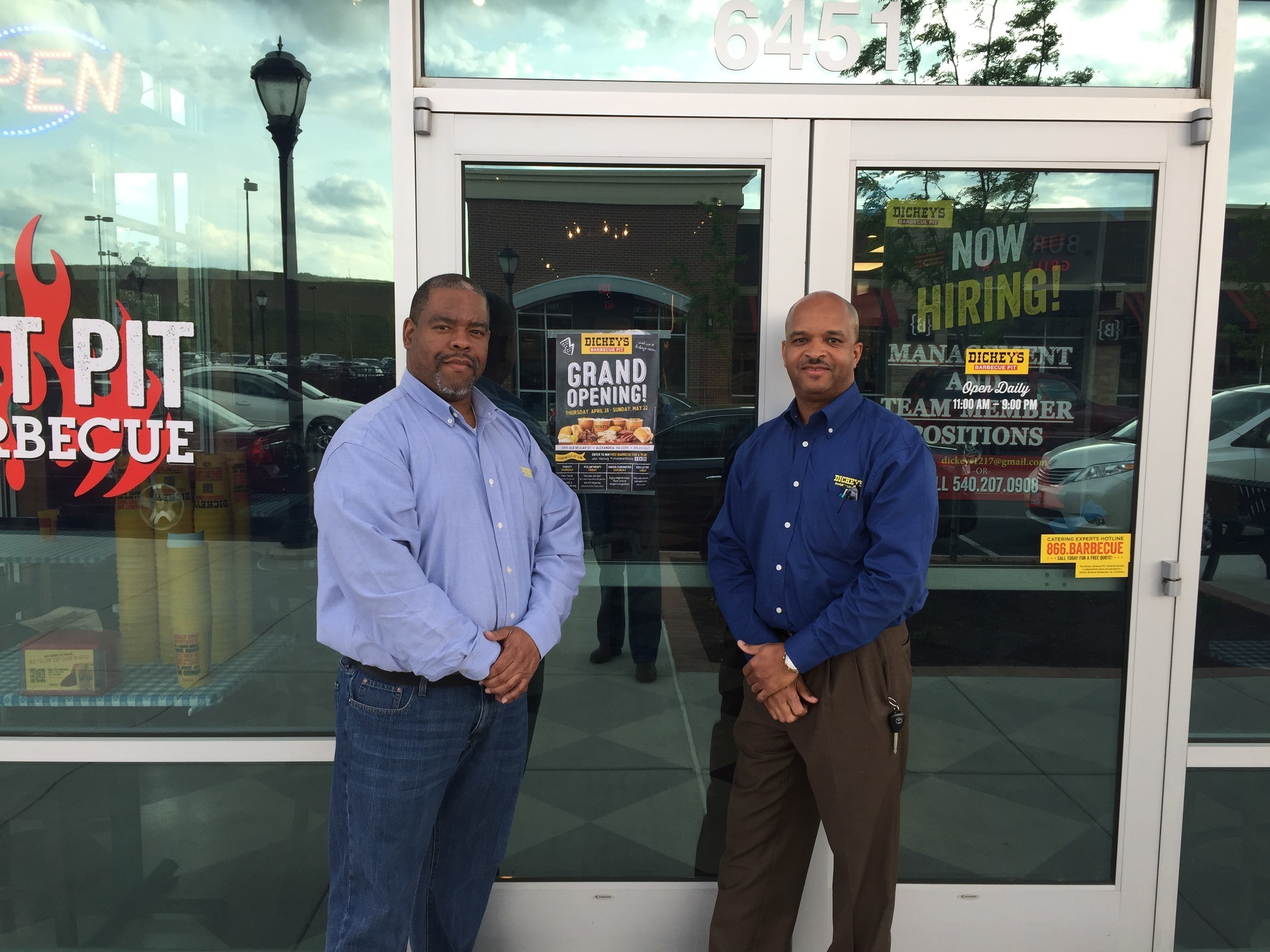 Owner/Operator James Wright (left) stands outside of his new Dickey's location in Alexandria.