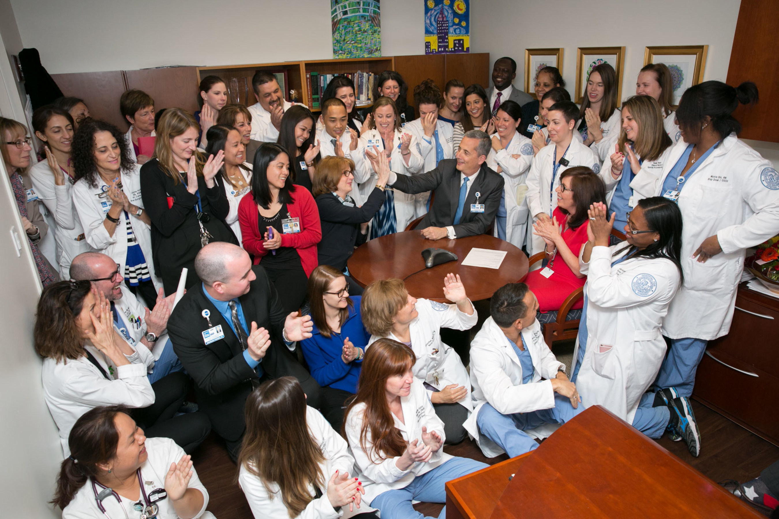 Hospital for Special Surgery nurses and leadership celebrate after hearing the hospital is first in the state of New York to receive a 4th Magnet designation.