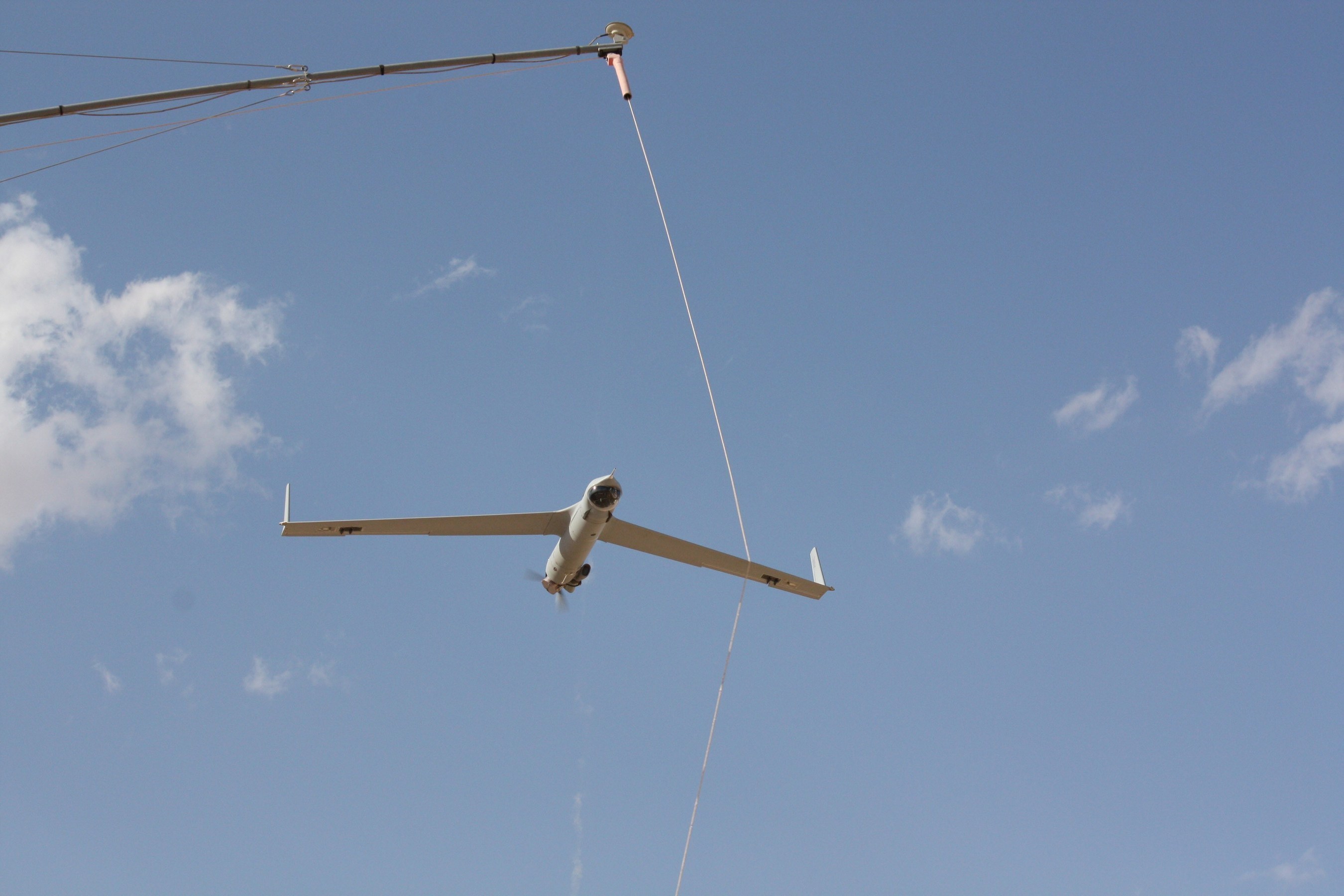 Insitu Pacific ScanEagle on recovery using SkyHook retrieval system