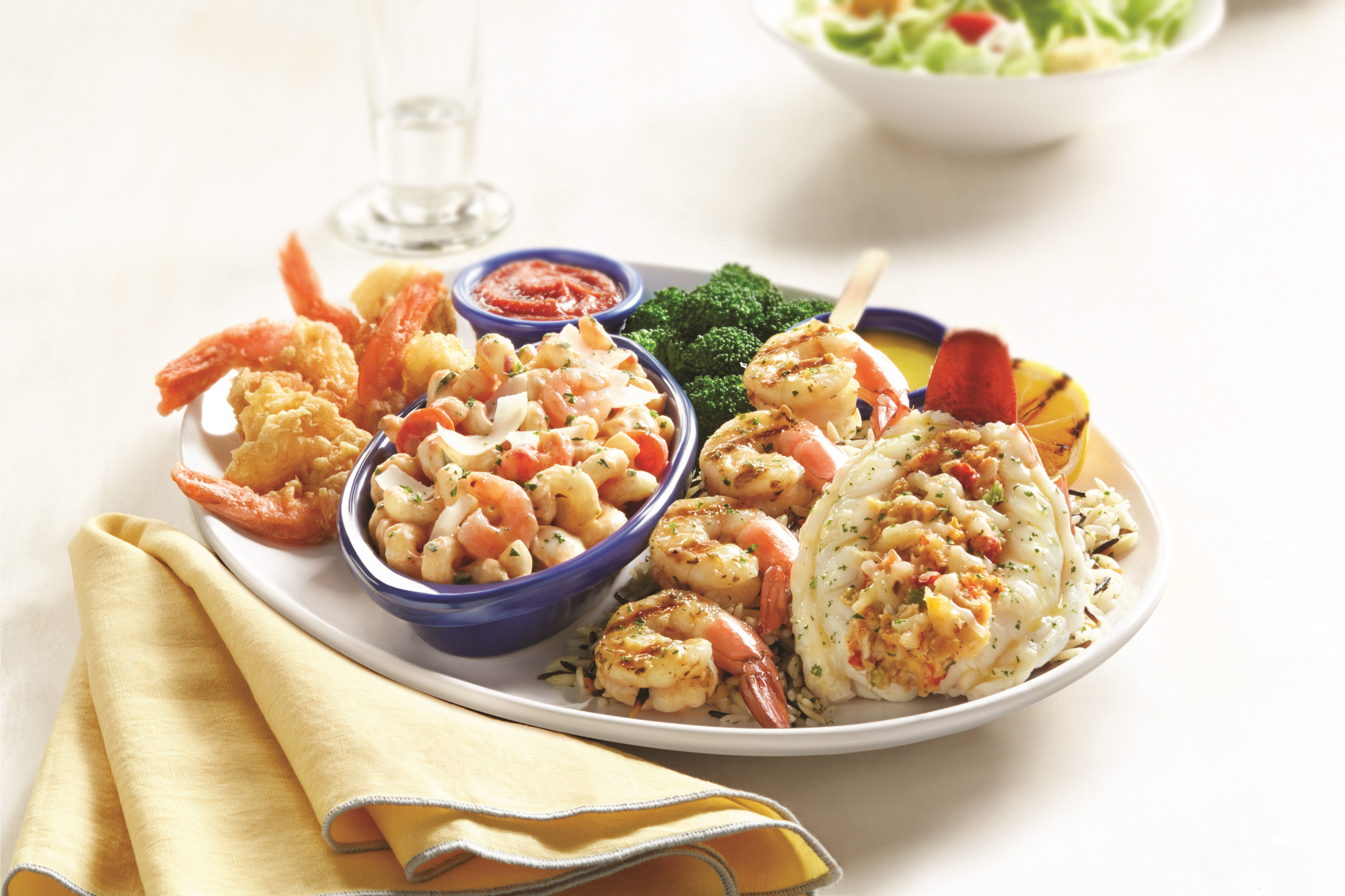 Red Lobster's new Lobster and Shrimp Overboard(TM) pairs a roasted and stuffed Maine lobster tail with a garlic-grilled jumbo shrimp skewer, Langostino Lobster and Shrimp Caprese Pasta and hand-battered jumbo shrimp.