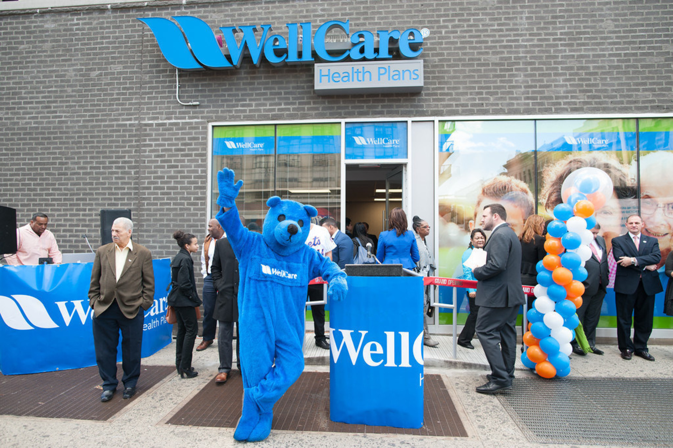 Blu, WellCare of New York's mascot, strikes a post outside WellCare's newest Welcome Center at 1365 Saint Nicholas Avenue in Manhattan's Washington Heights. WellCare Welcome Centers are neighborhood health information, education and activity centers.