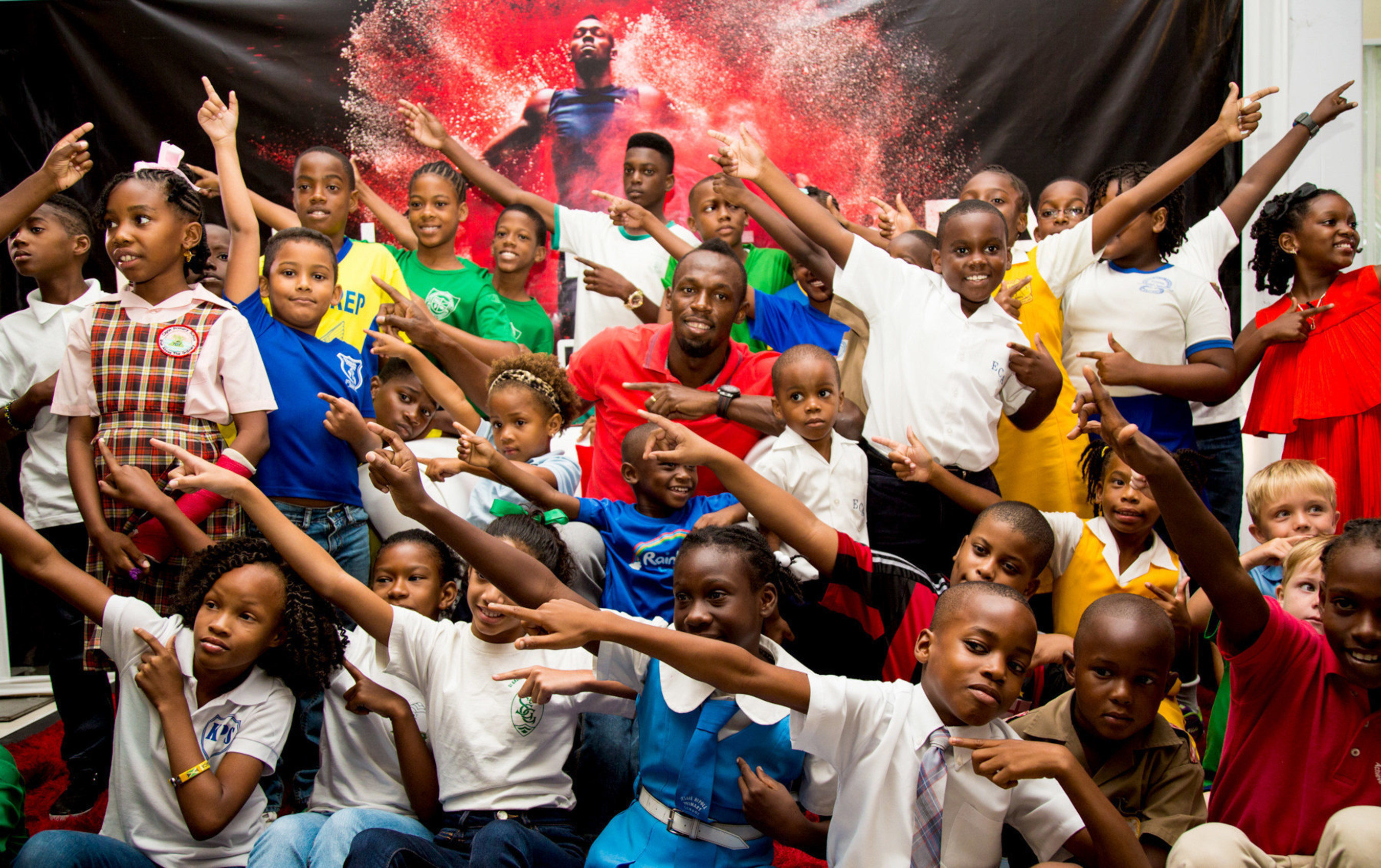 Digicel invited aspiring little newshounds from across the Caribbean to a kiddie press conference with Usain Bolt, the world's fastest man in the hot seat. The kiddie press pack surrounds Usain for an impromptu lightning bolt having peppered him with probing questions like "How many girlfriends do you have?" and "What do you think of vegetables?" in Kingston, Jamaica on Tuesday.