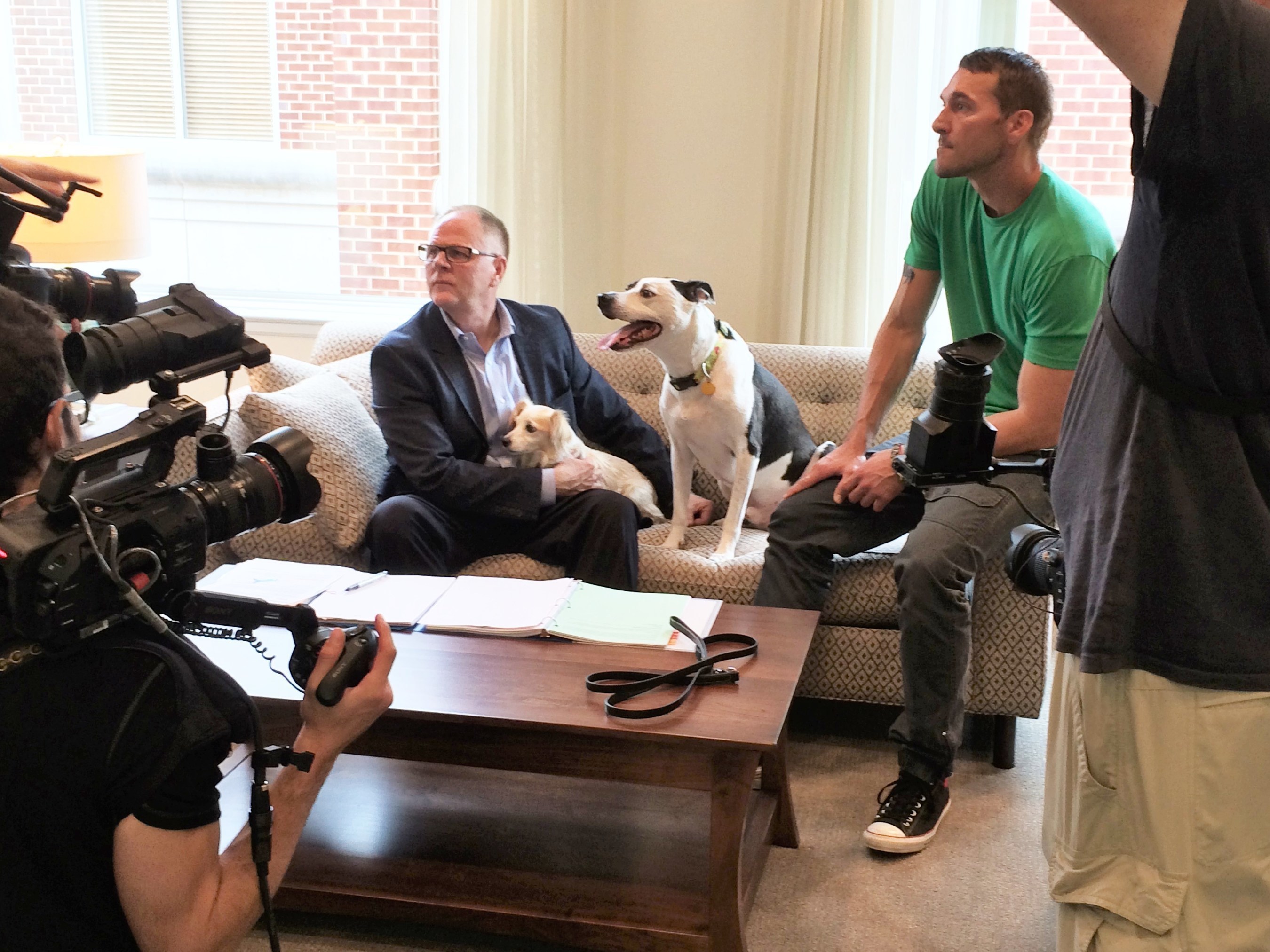 Kris Kiser; rescue dog Dottie; Lucky the TurfMutt, and Brandon McMillan of Lucky Dog discuss the new episode with the production team.