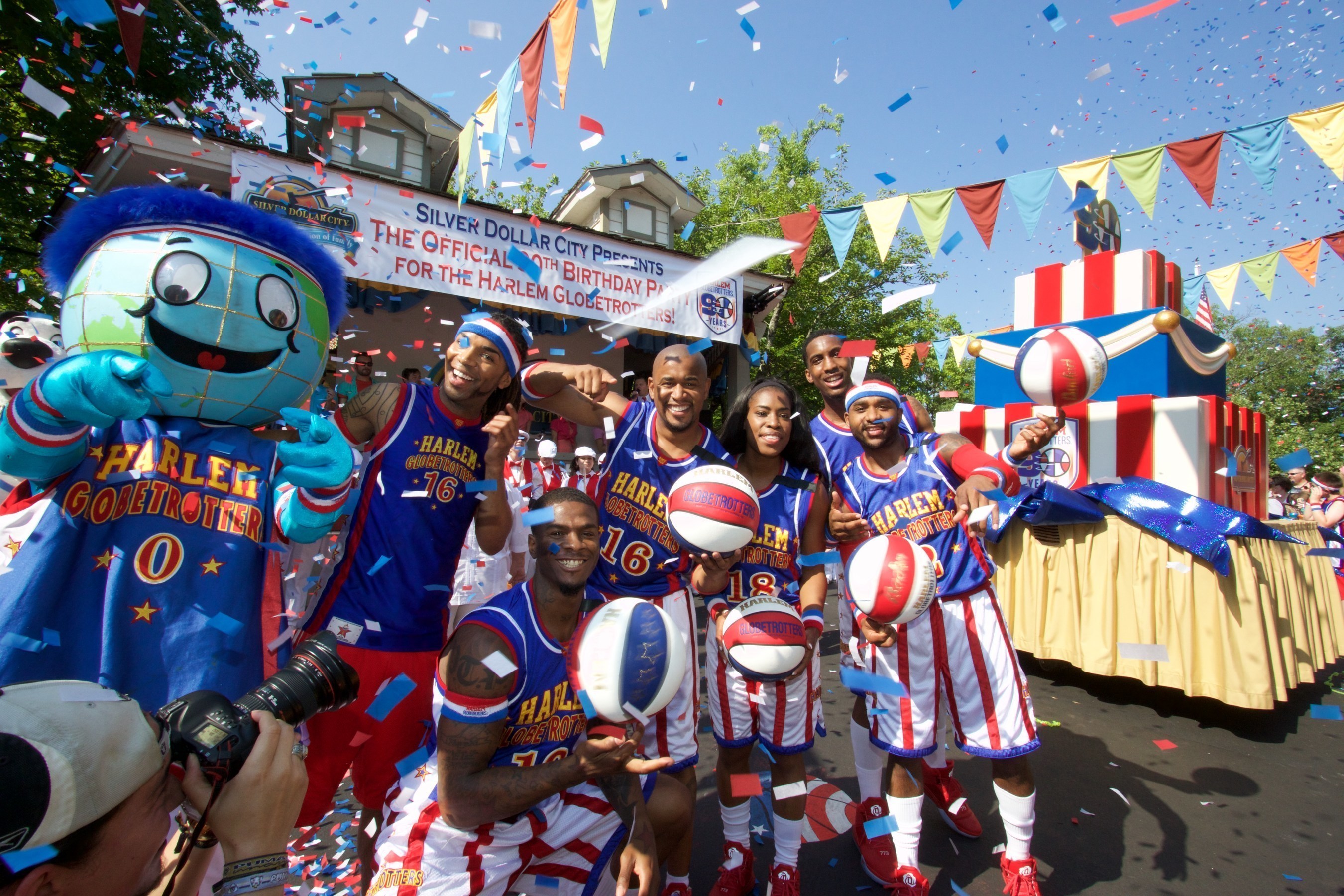 The Harlem Globetrotters celebrate their 90th Birthday with a 12-foot tall birthday cake, a marching band and performers at Silver Dollar City in Branson, Missouri.