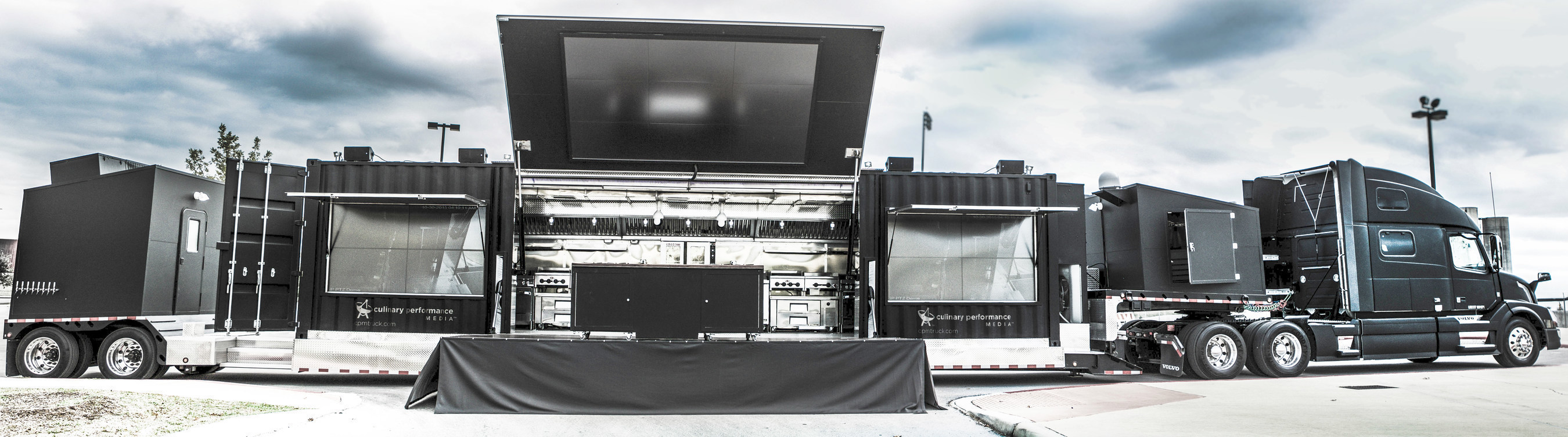 The behemoth, 70-foot T.R.U.C.K! unfolds to reveal dual competition pro kitchens, a roll-out stage, and three interactive audio/visual display walls.
