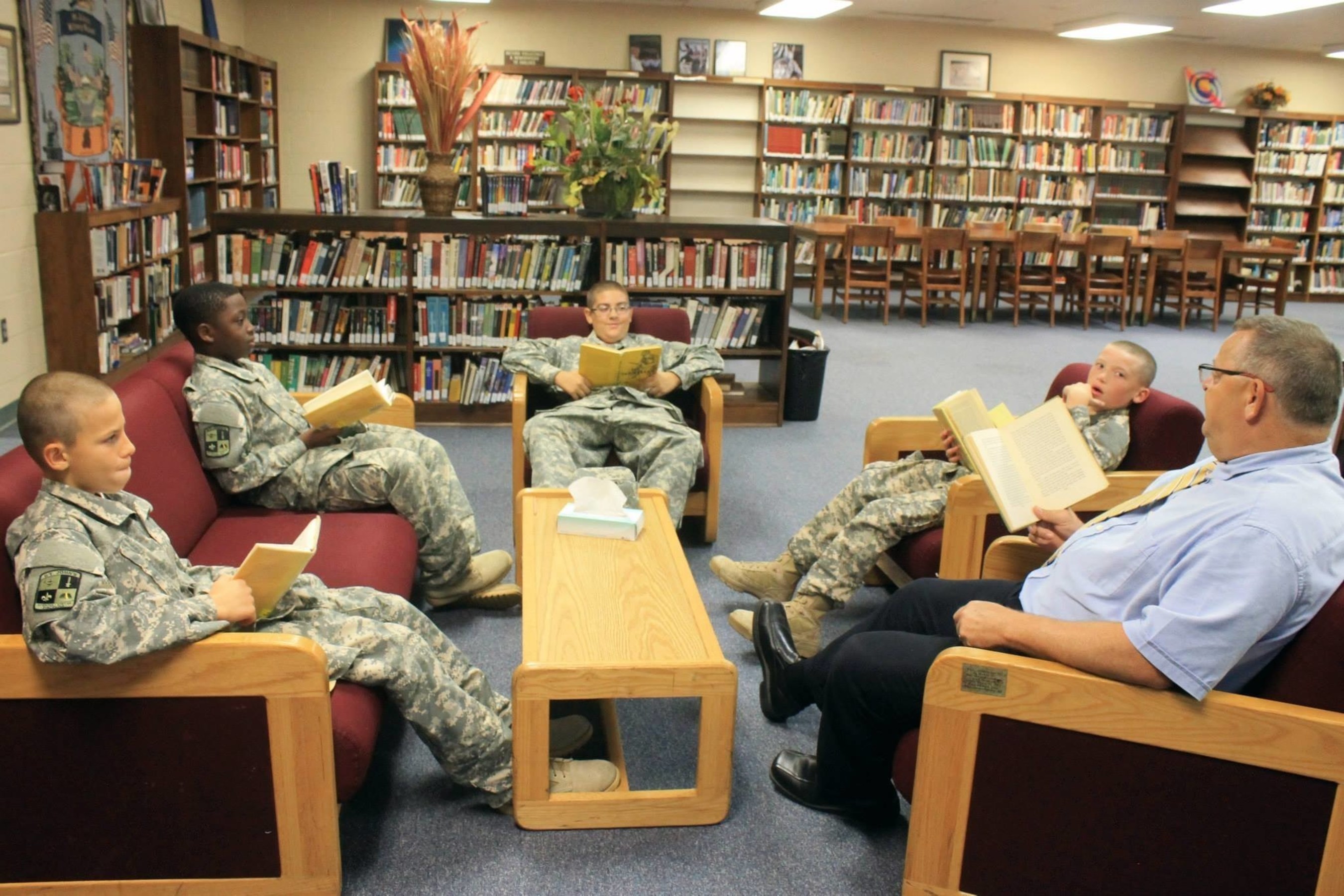 St. John's Military School 6th grade teacher Dan Jones, gets out from behind their desks whenever possible. Here, they read and discuss Old Yeller, the classic tale about a boy and his dog.