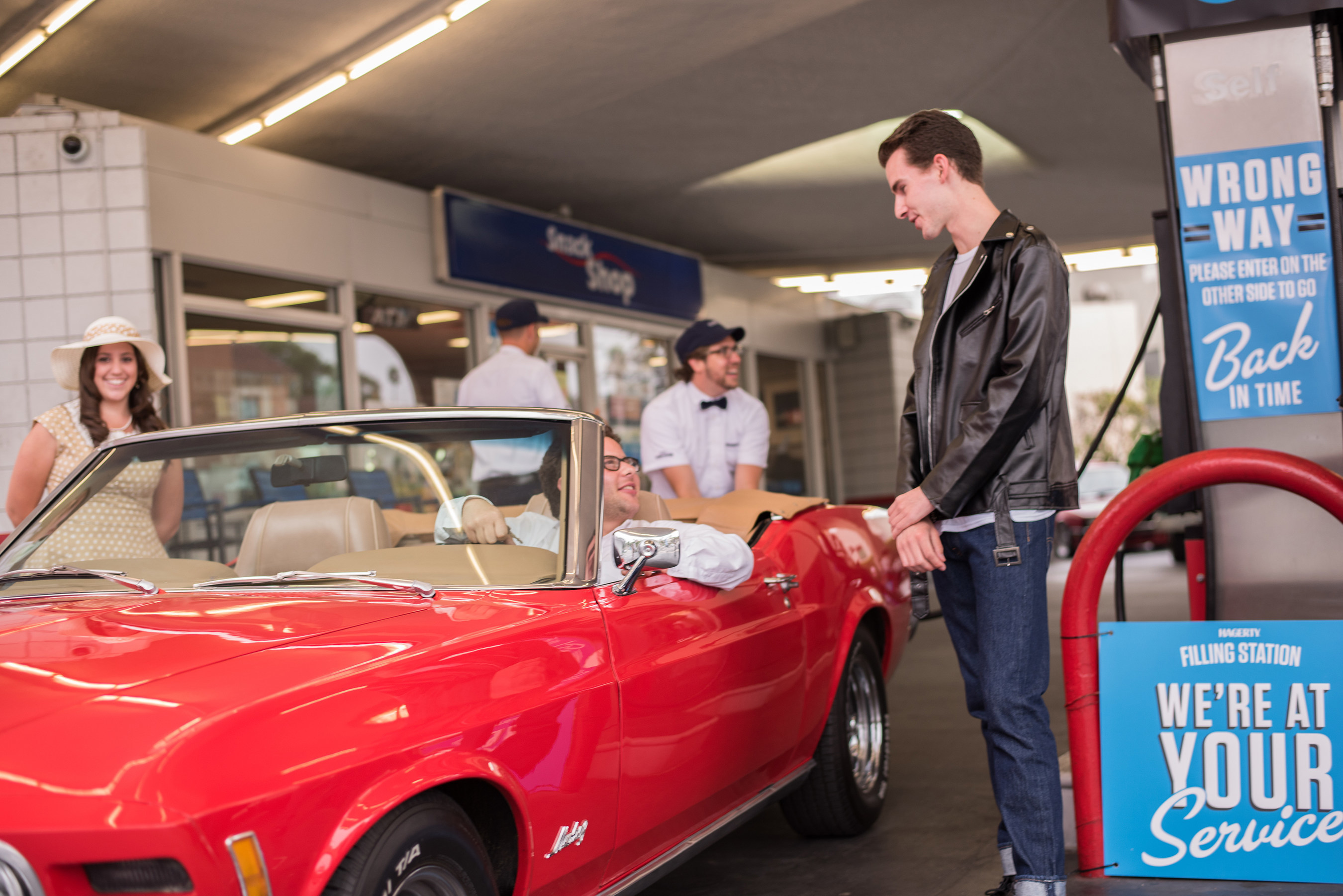 Jason Perls Miller, 28, of Culver City, CA with his 1970 Ford Mustang Convertible purchased gas for 35 cents a gallon during the Hagerty vintage gas station event celebrating National Collector Car Appreciation Day.