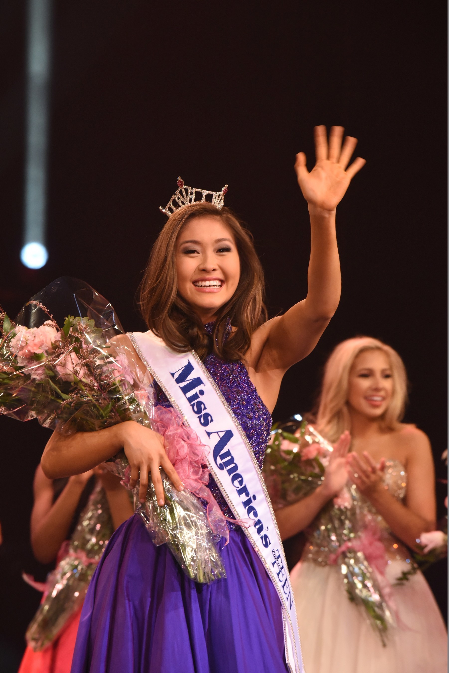 Miss America's Outstanding Teen 2017 Nicole Jia takes her first walk and waves to the crowd after being crowned at the Linda Chapin Theater inside the Orange County Convention Center in Orlando. www.maoteen.org