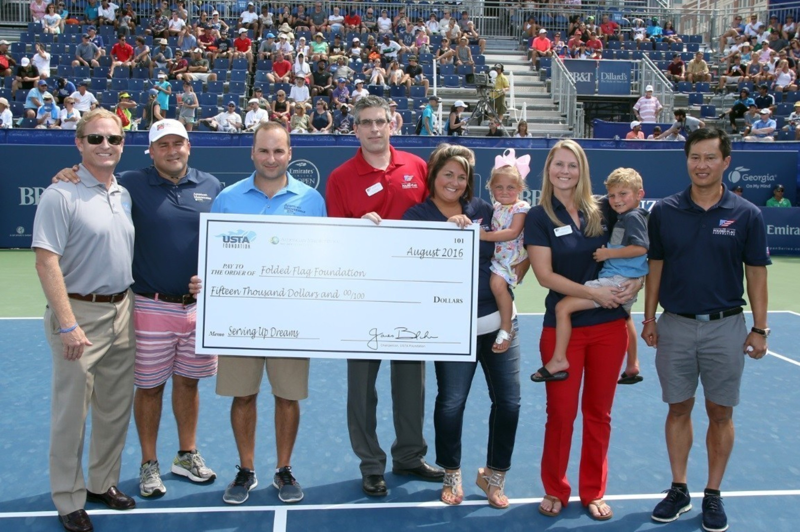 USTA Foundation President Dan Faber (L) meets John Coogan (C), Executive Director of The Folded Flag Foundation, and Peter Brual (R), Folded Flag Foundation Trustee, to present the $15,000 donation.