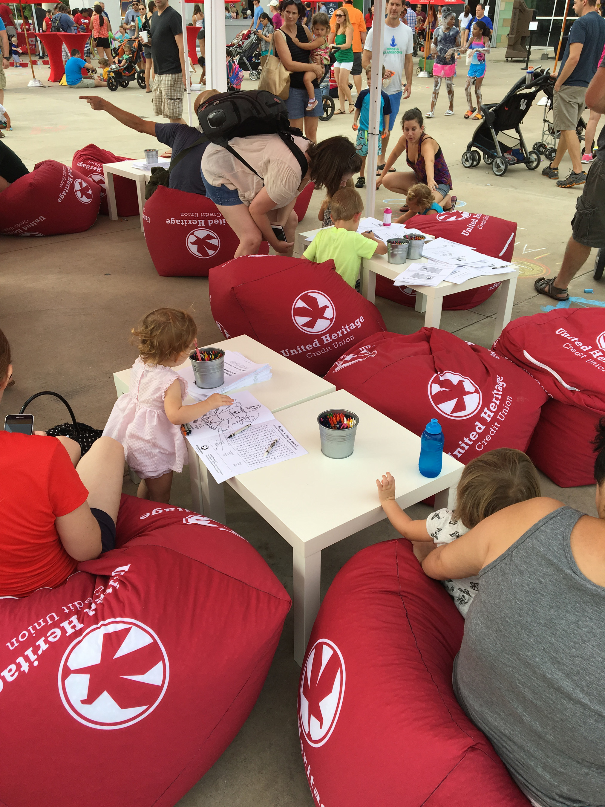 Austin families enjoy coloring books and relax ​on bean ​bag chairs in the United Heritage Credit Union Chill Zone during Bubblepalooza! on July 16, 2016, at the Long Center.