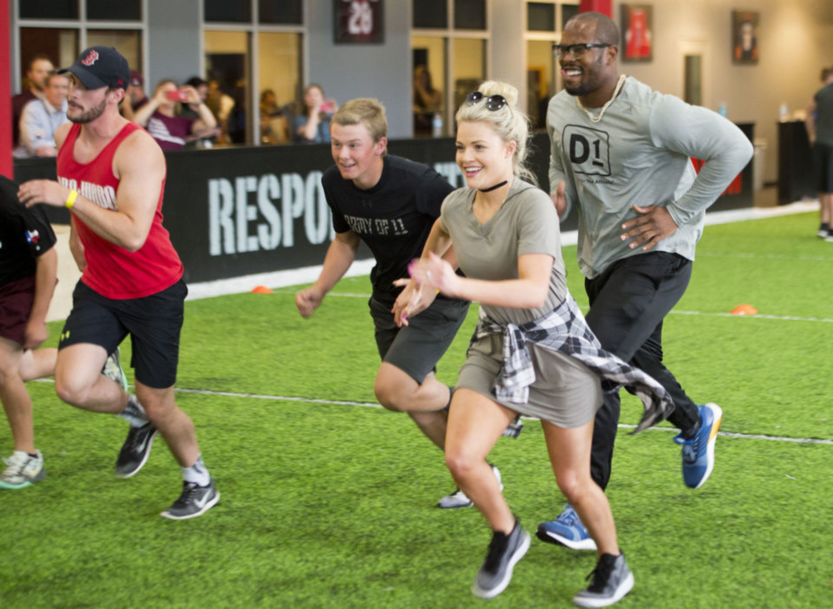 D1 Co-Owner Von Miller with former "Dancing With The Stars" partner Witney Carson and members at the D1 Athlete Experience in College Station.