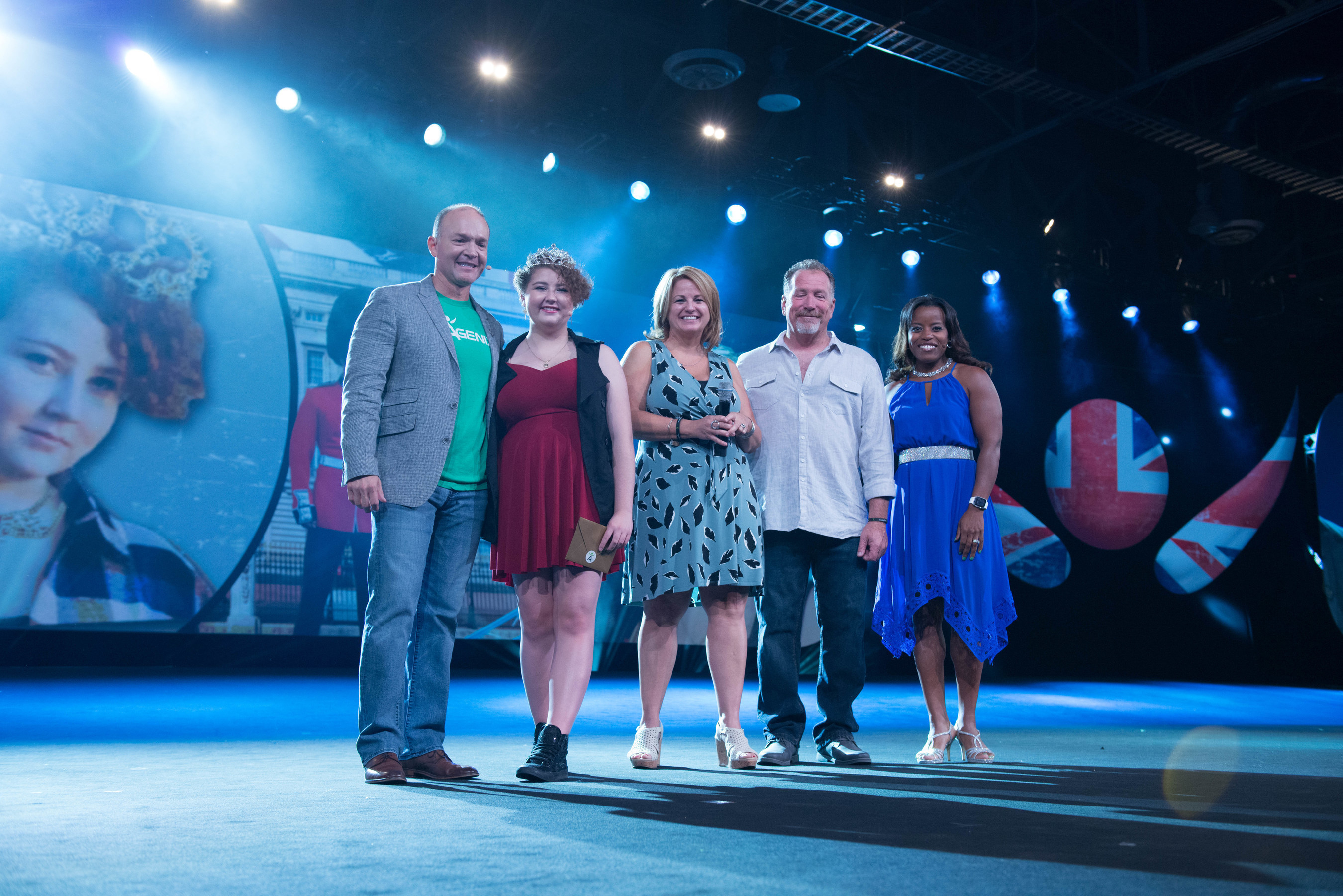 Isagenix Chief Sales and Marketing Officer, Travis Garza, Make-A-Wish and liver cancer survivor Jordyn Preston and parents Don and Beverly and Isagenix team member Elizabeth Martinsen who lost her child to cancer, celebrate the granting of Jordyn's wish - a trip to London at the company's annual 2016 Celebration event in Las Vegas.