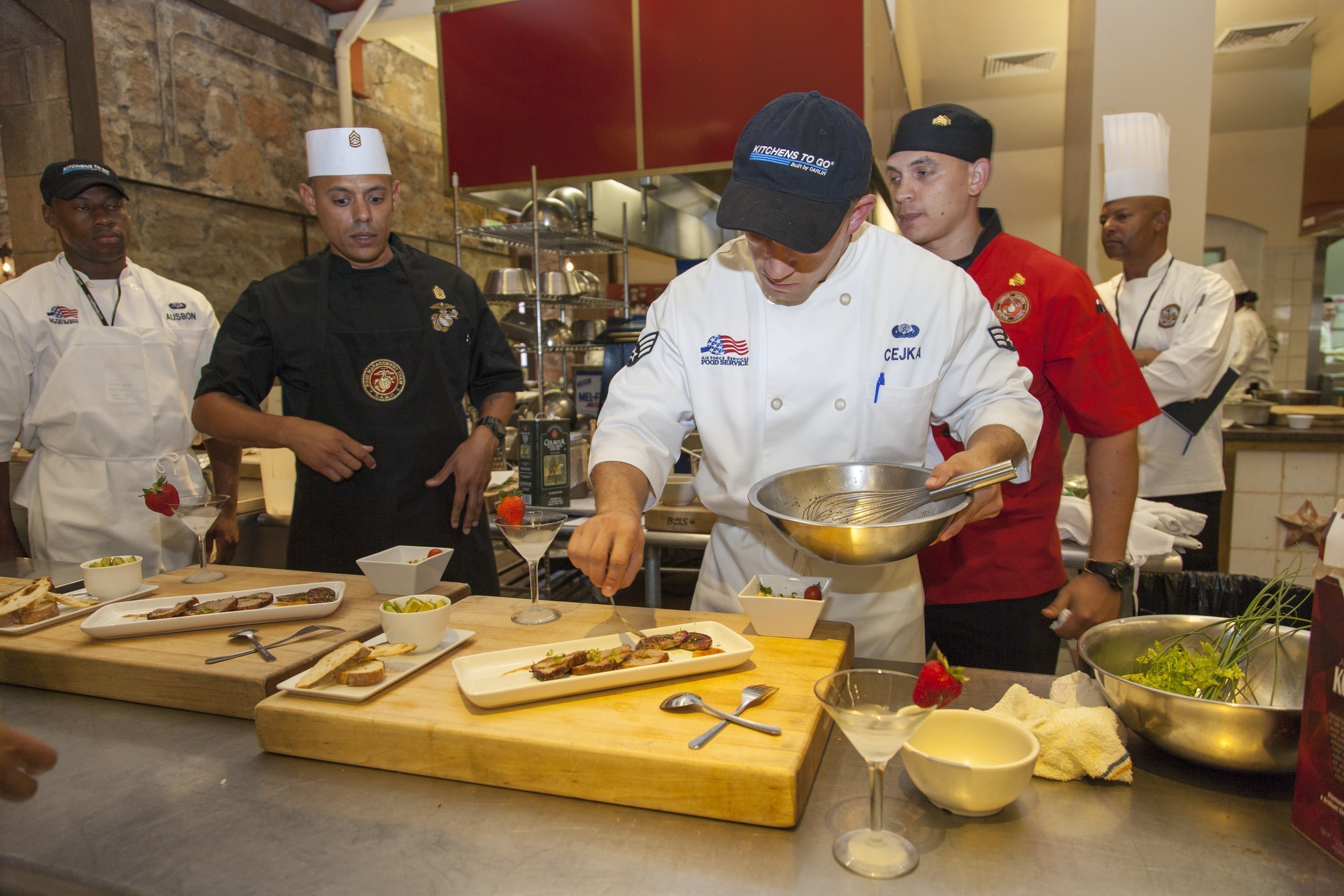 Senior Airman Caleb Cejka puts the finishing touches on his team's recipe challenge dish at the 2016 Armed Forces Forum for Culinary Excellence, hosted at The Culinary Institute of America at Greystone, in California.