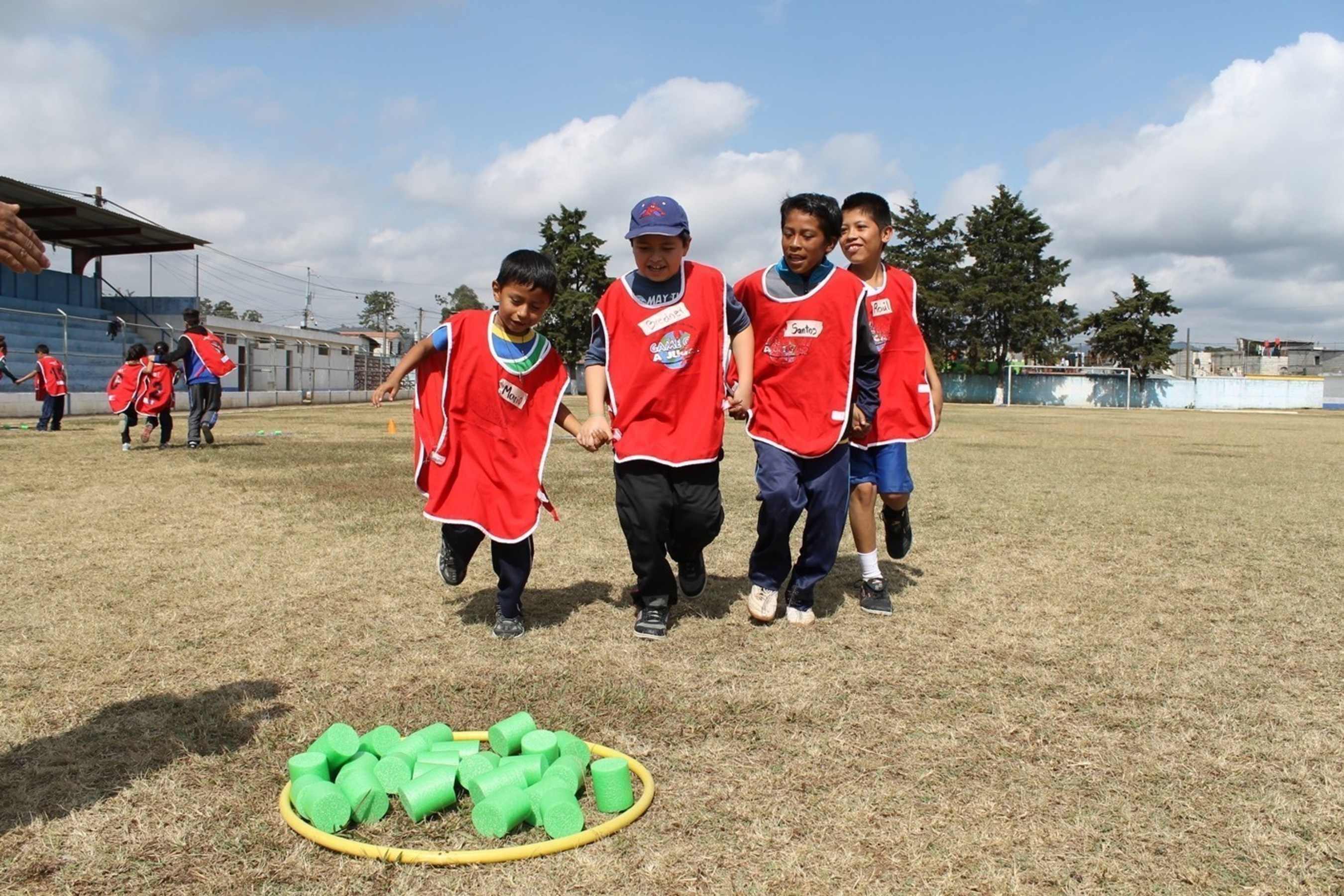Teamwork is one important life skill kids learn in Children International's Sports for Development program.