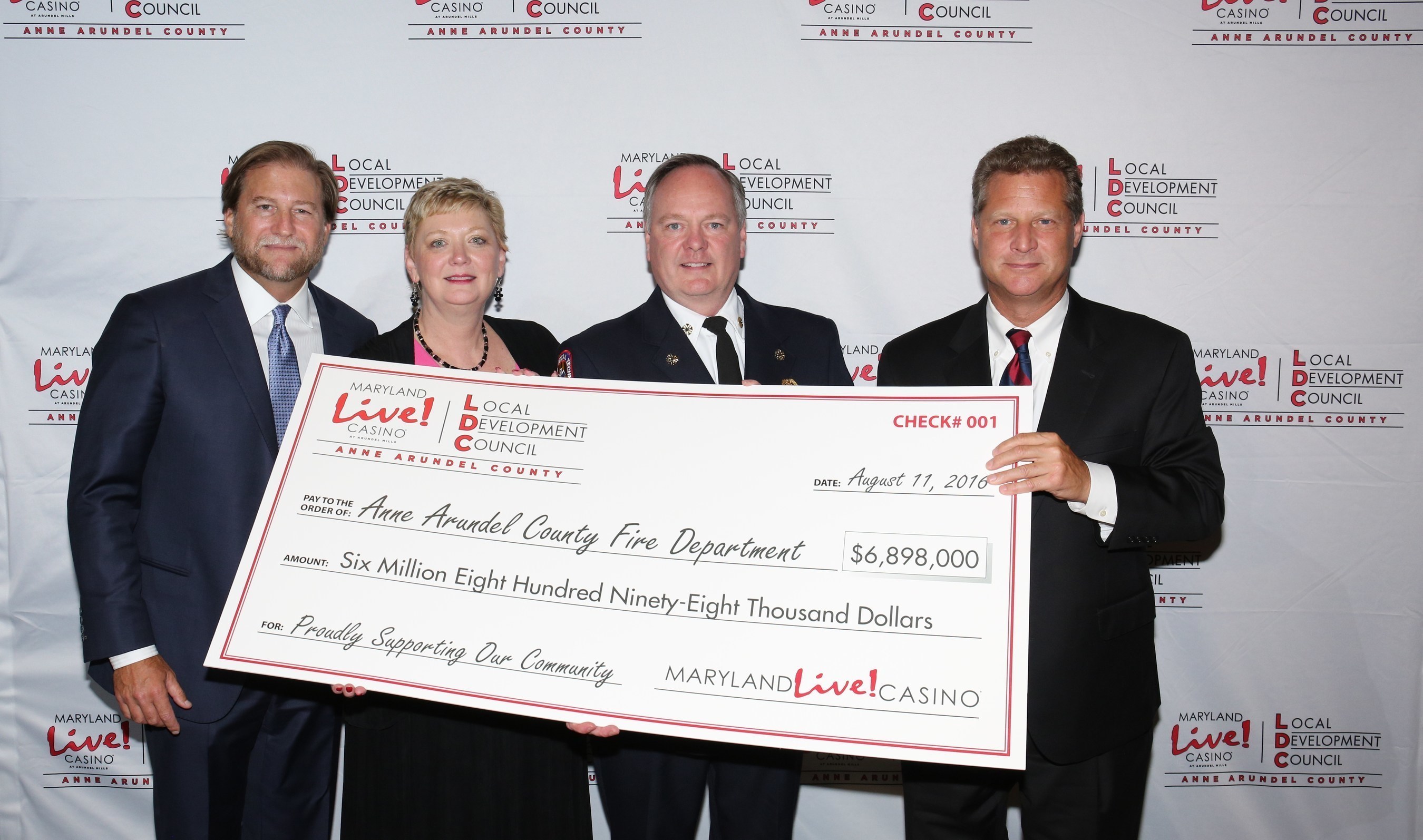 Maryland Live! Casino and Anne Arundel County today awarded more than $18.6 million in local impact grants for fiscal year 2017 to various grant recipients as recommended by the Local Development Council (LDC), which helps to manage the allocation of county gaming tax revenue to local organizations. Joe Weinberg, Managing Partner of The Cordish Companies (far left); Anne Arundel County Executive Steve Schuh (far right); and Claire Louder, Chair of the LDC, (2nd from left) officially presented the grants, including one for $6.8 million to Anne Arundel County Fire Chief Allan Graves.
