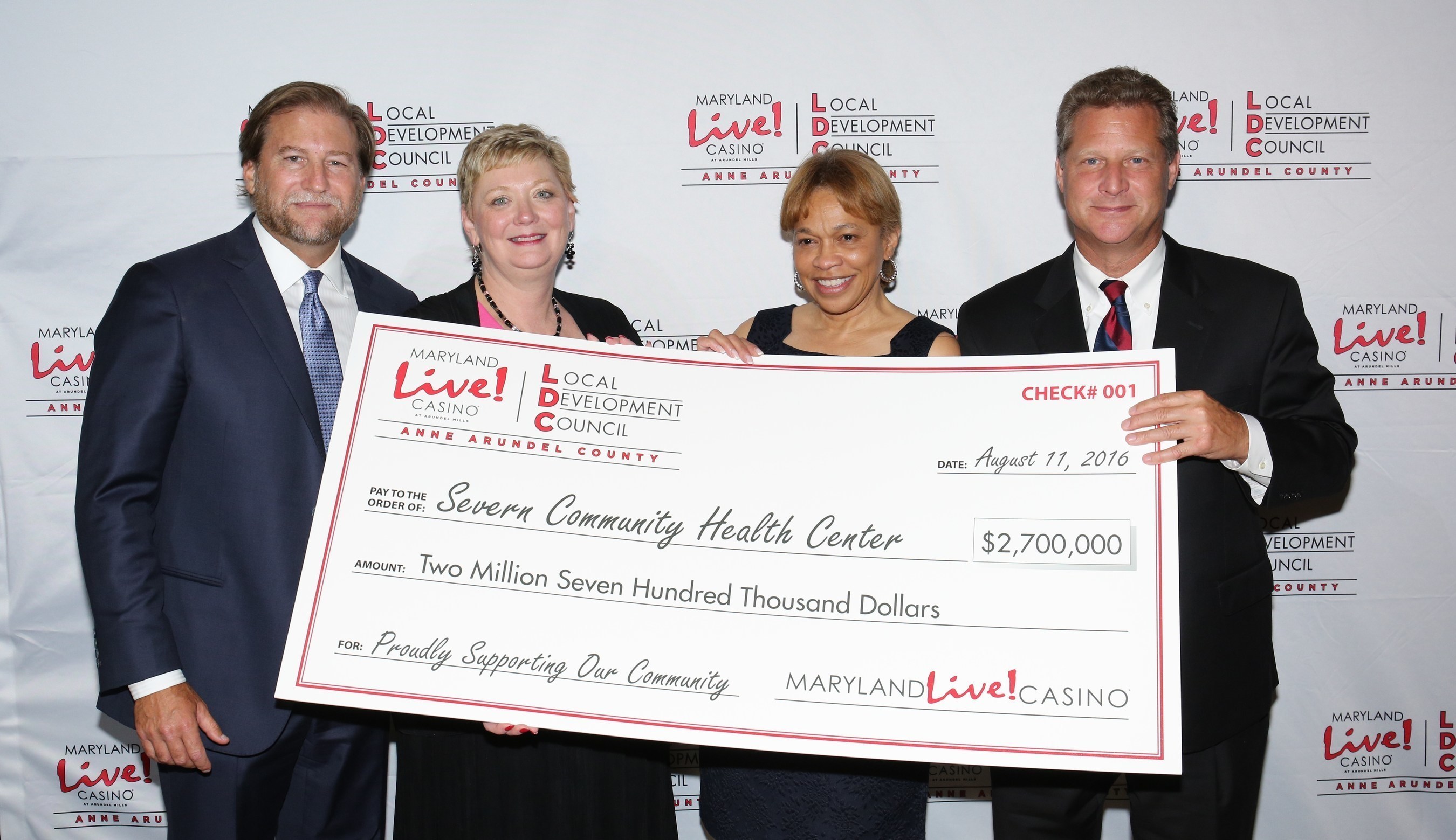 Maryland Live! Casino and Anne Arundel County today awarded more than $18.6 million in local impact grants for fiscal year 2017 to various grant recipients as recommended by the Local Development Council (LDC), which helps to manage the allocation of county gaming tax revenue to local organizations. Joe Weinberg, Managing Partner of The Cordish Companies (far left); Anne Arundel County Executive Steve Schuh (far right); and Claire Louder, Chair of the LDC, (2nd from left) officially presented the grants, including one for $2.7 million to Severn Community Center Executive Director Faye Royale-Larkins. (2nd from right).