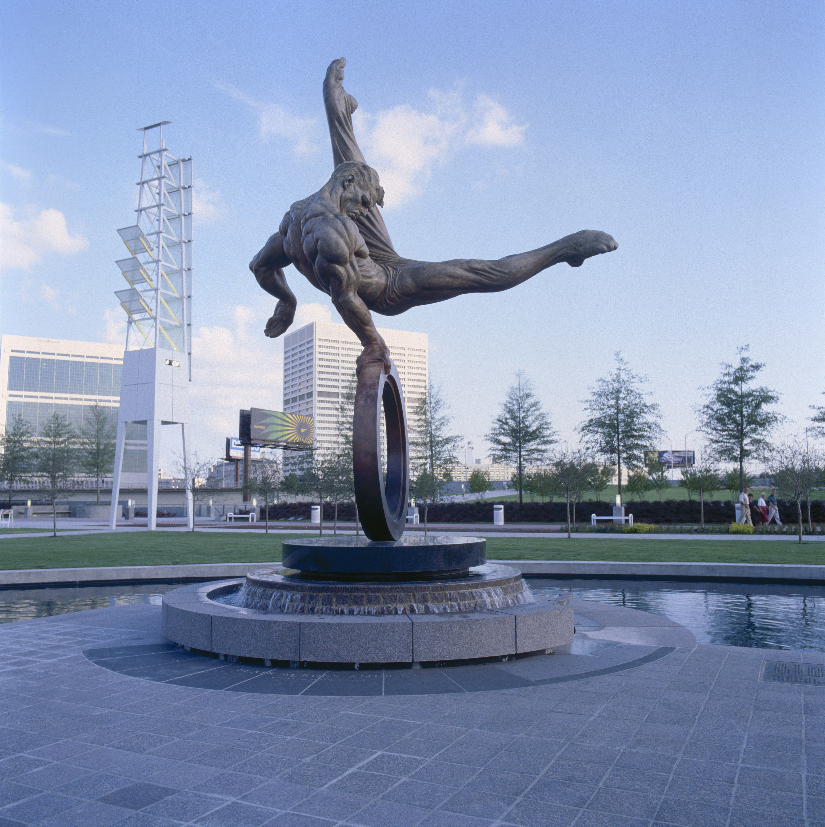 Created for the 1996 Atlanta Olympics, "Flair Across America - The Gymnast" by sculptor Richard MacDonald is a celebration of the triumph of the human spirit - the dedication, tenacity and determination of every individual in the pursuit of excellence. Flair Across America is a the 26-foot high heroic bronze monument that resides permanently at Georgia International Plaza in Atlanta, Georgia.