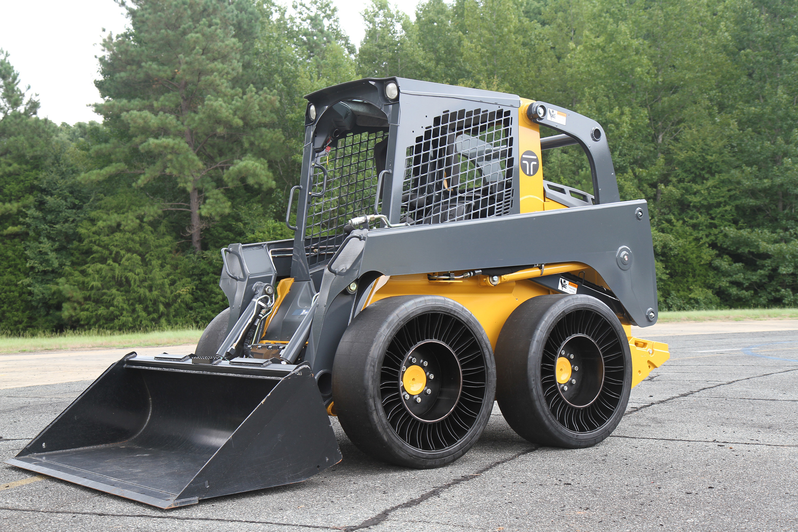 The TWEEL(R) SSL Hard Surface is designed for operators who are involved with construction, transfer stations, waste handling, pavement maintenance or material handling and benefit from a hard surface version of an airless radial skid steer tire.