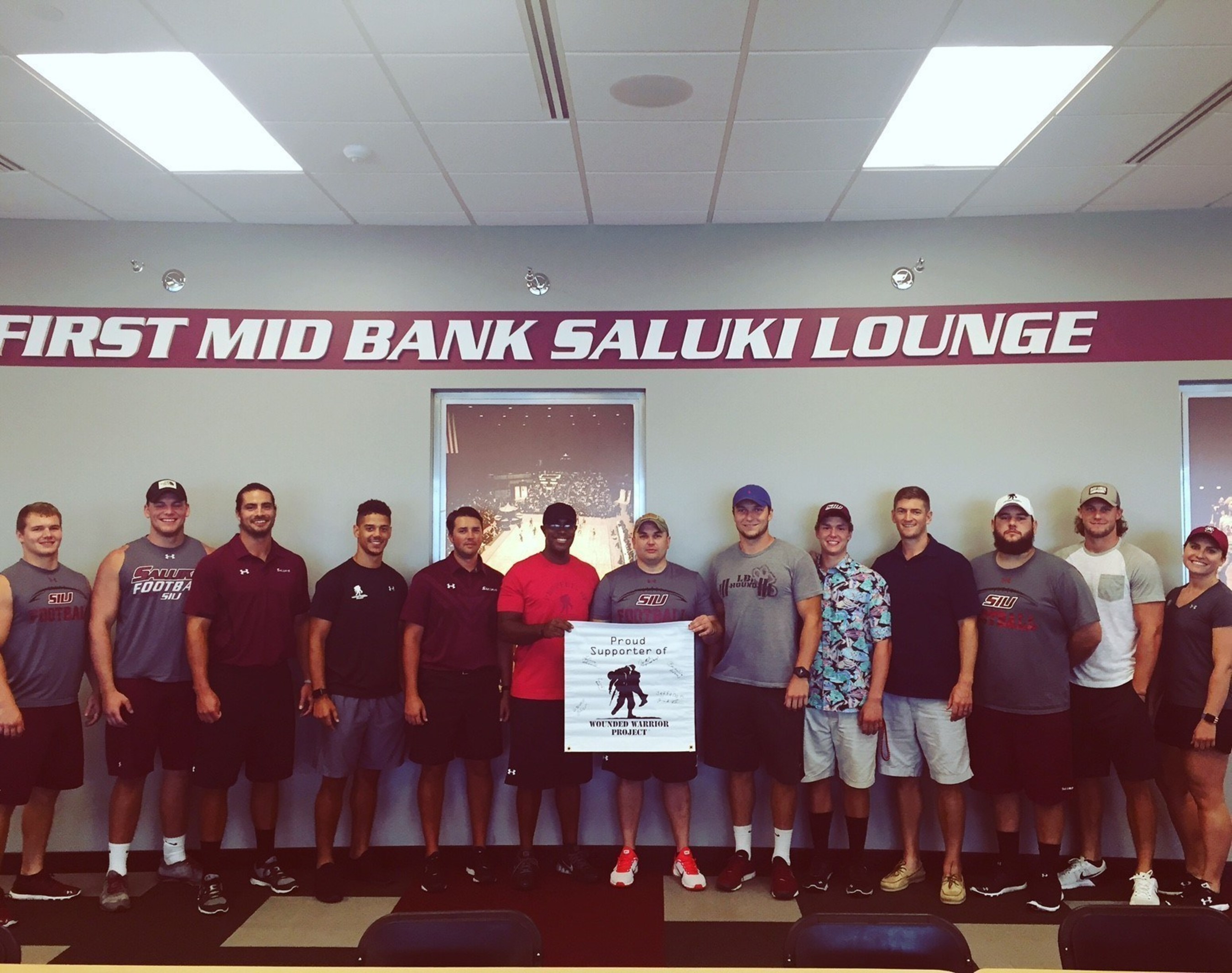 Warriors pose with Southern Illinois University staff, during a workout event sponsored by Wounded Warrior Project.