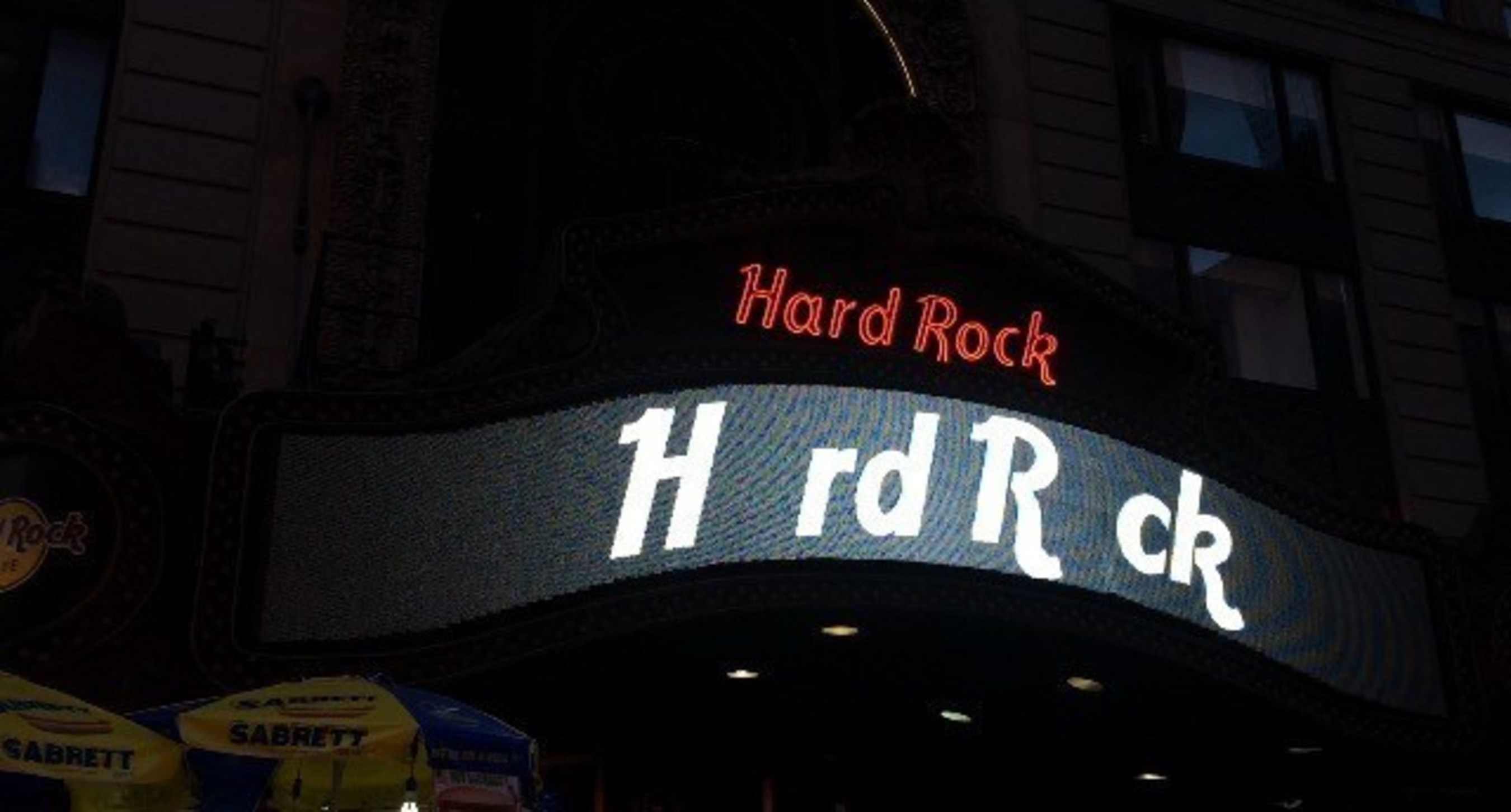 Hard Rock Cafe shows support for the #MissingType campaign by removing the 'A' and 'O' from their iconic Times Square digital sign.