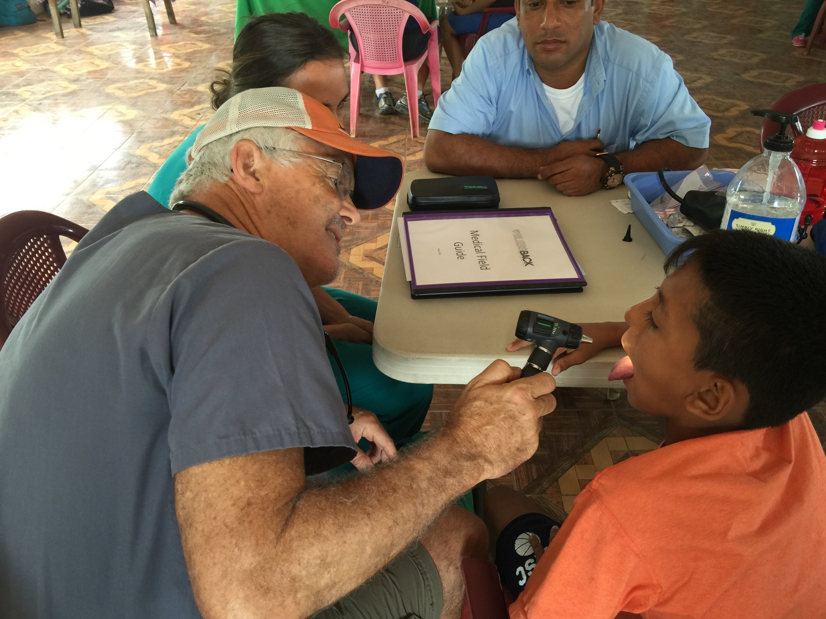 Dr. Roy Blank evaluates a patient in Nicaragua.