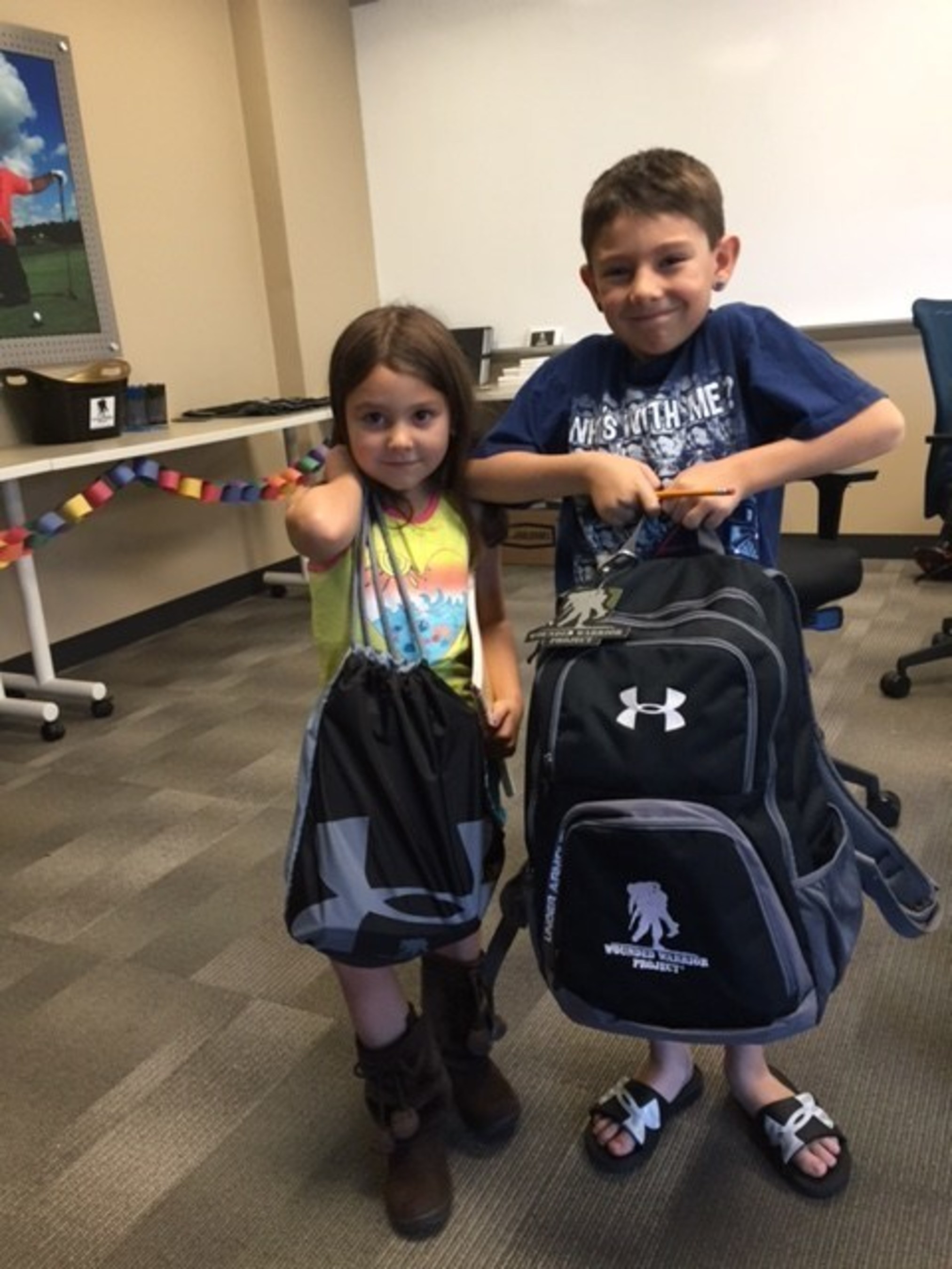 Children of injured veterans were given supply-filled backpacks as part of a recent Wounded Warrior Project back-to-school open house.