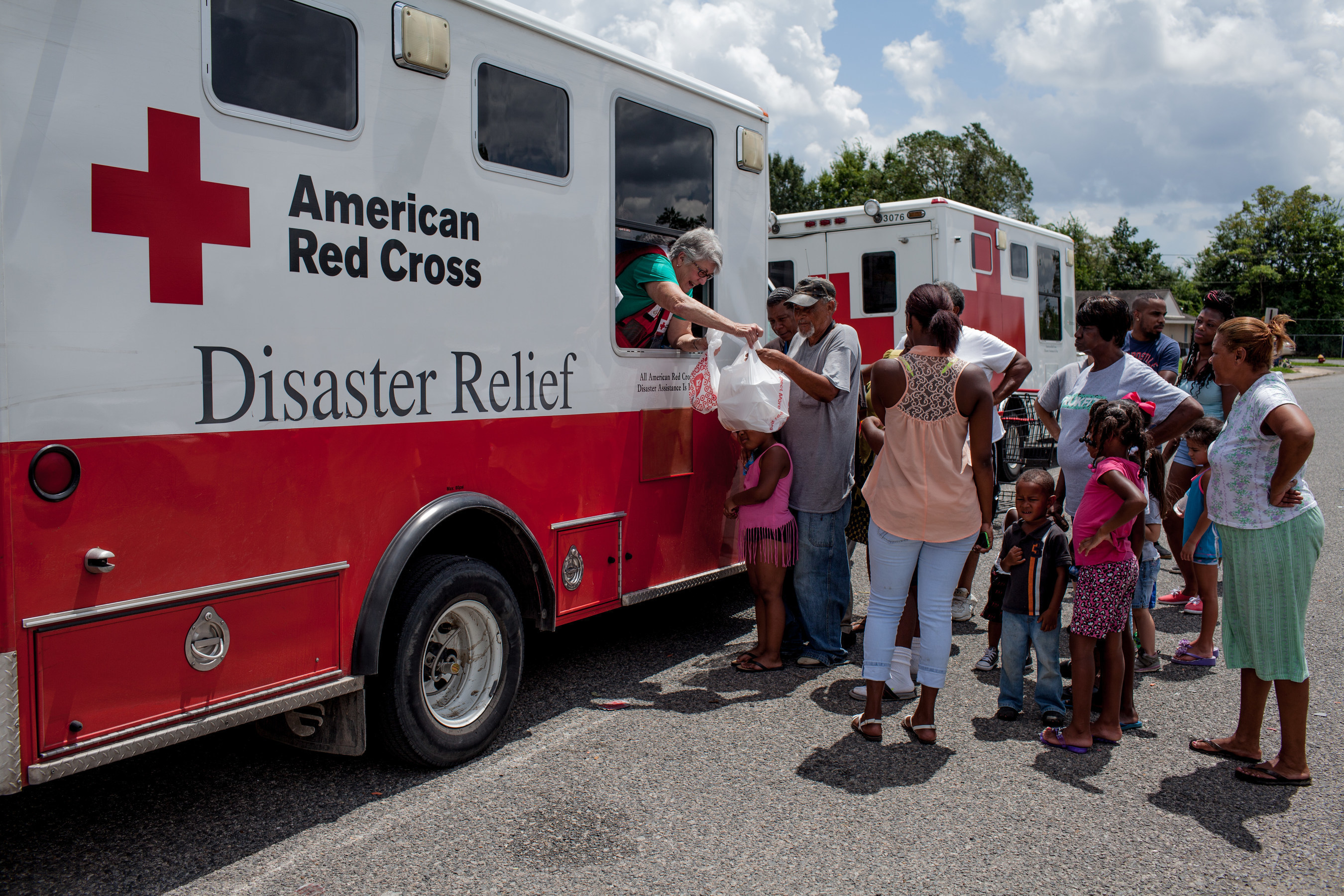 Red Cross workers distribute hot meals in Eunice, St. Landry Parish, Louisiana. Red Cross photo by Marko Kokic