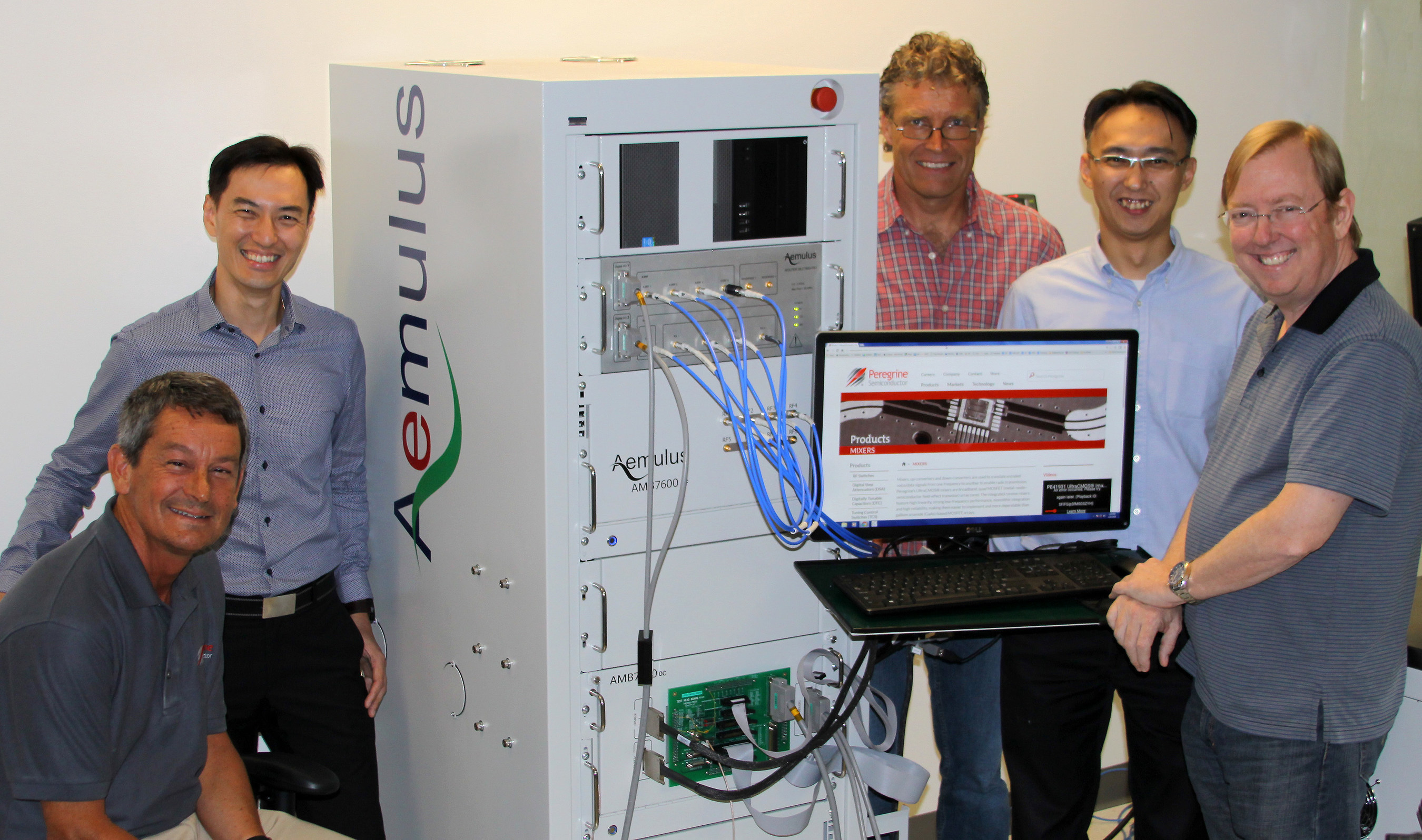 Aemulus and Peregrine Semiconductor collaborate on the development of a new microwave frequency tester. Pictured from left to right: Jim Cable, CEO of Peregrine Semiconductor; Sang Beng Ng, CEO of Aemulus; Carl Tulberg, principal engineer, NPI operations at Peregrine; E Chiang Tan, senior marketing director at Aemulus; and Jeff Bartlett, manager, production test development at Peregrine.