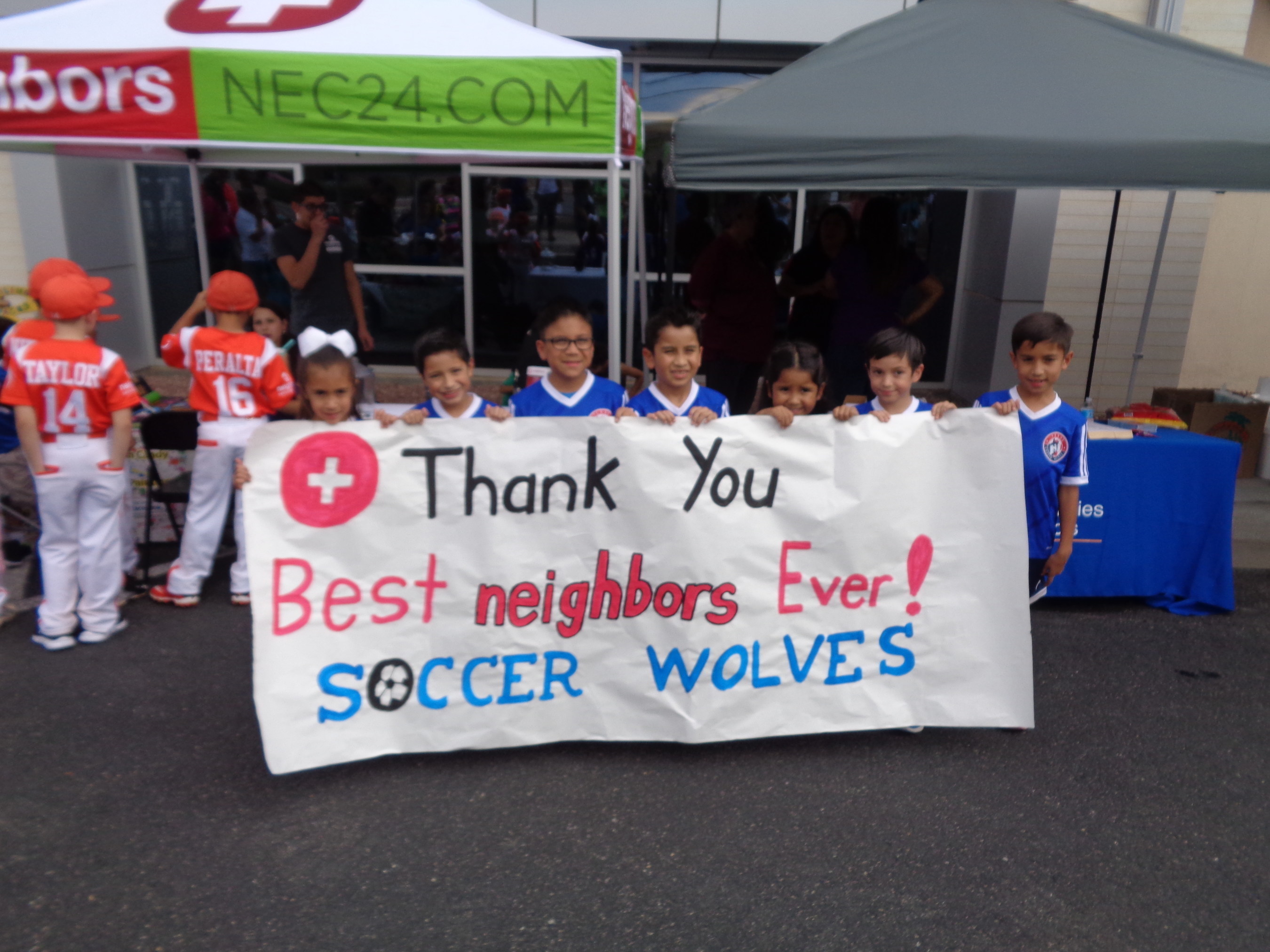 Local children's soccer teams thank the Zaragoza Neighbors Emergency Center location for their support.