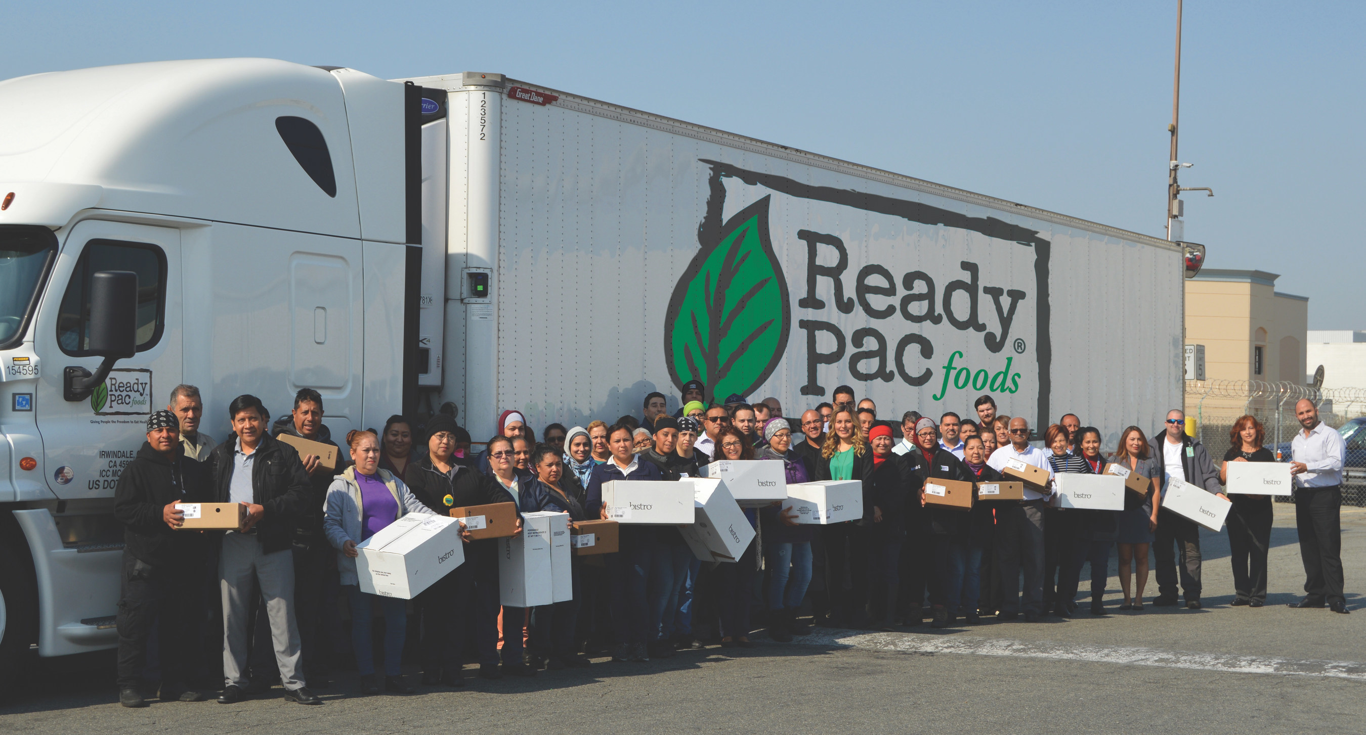 Ready Pac Foods Associates loading 30,000 salads onto truck bound for Baton Rouge, La. Flood victims.