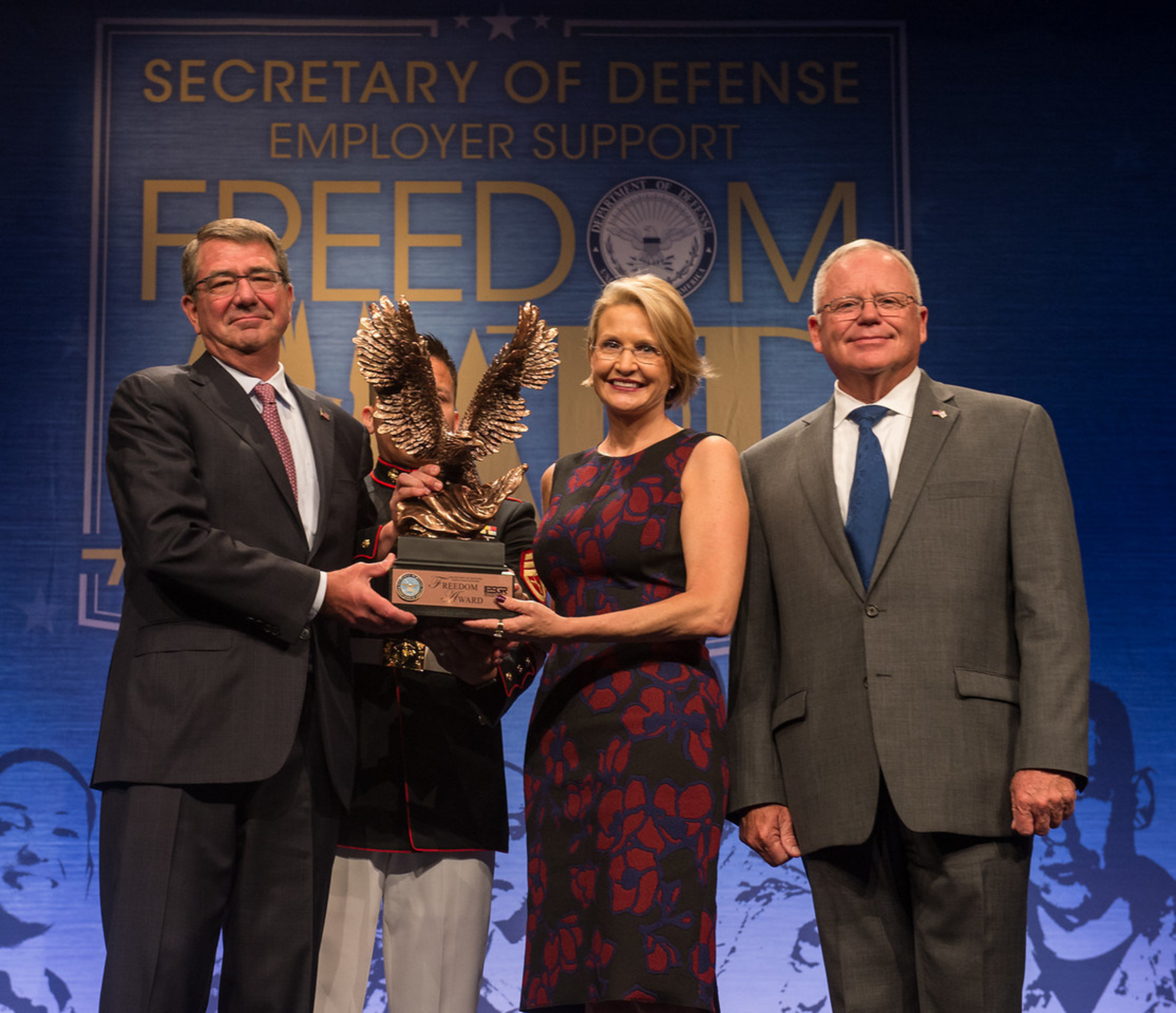 Secretary of Defense, Ashton B. Carter recognizes CEO Catherine Monson of FASTSIGNS International, Inc. at the DoD Freedom Awards, August 26, 2016 in the Pentagon Auditorium. (U.S. Army photo by Sgt. Ricky Bowden)