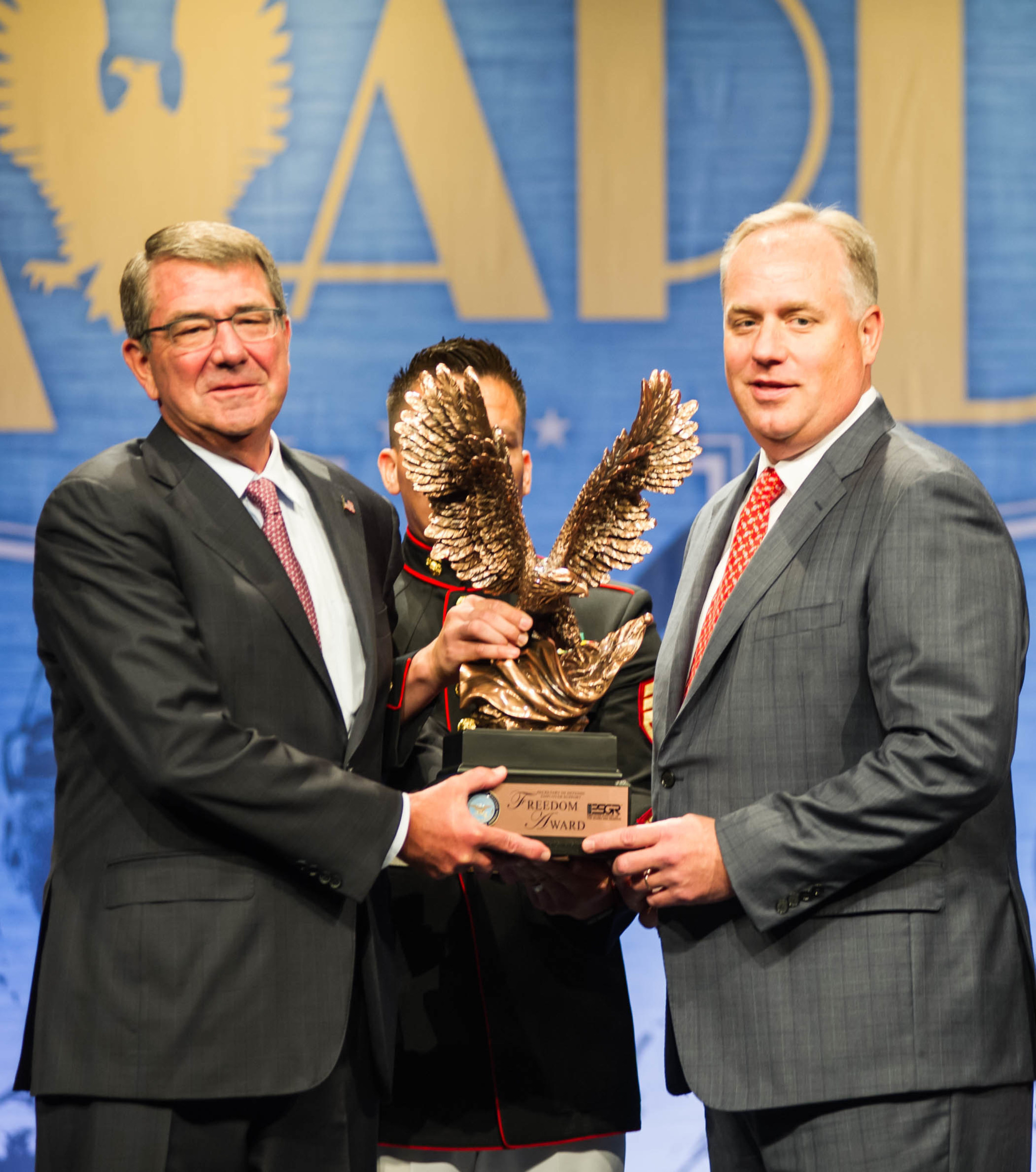 Secretary of Defense Ash Carter presented the Employer Support Freedom Award trophy to Steve McClellan, president of Goodyear Americas.