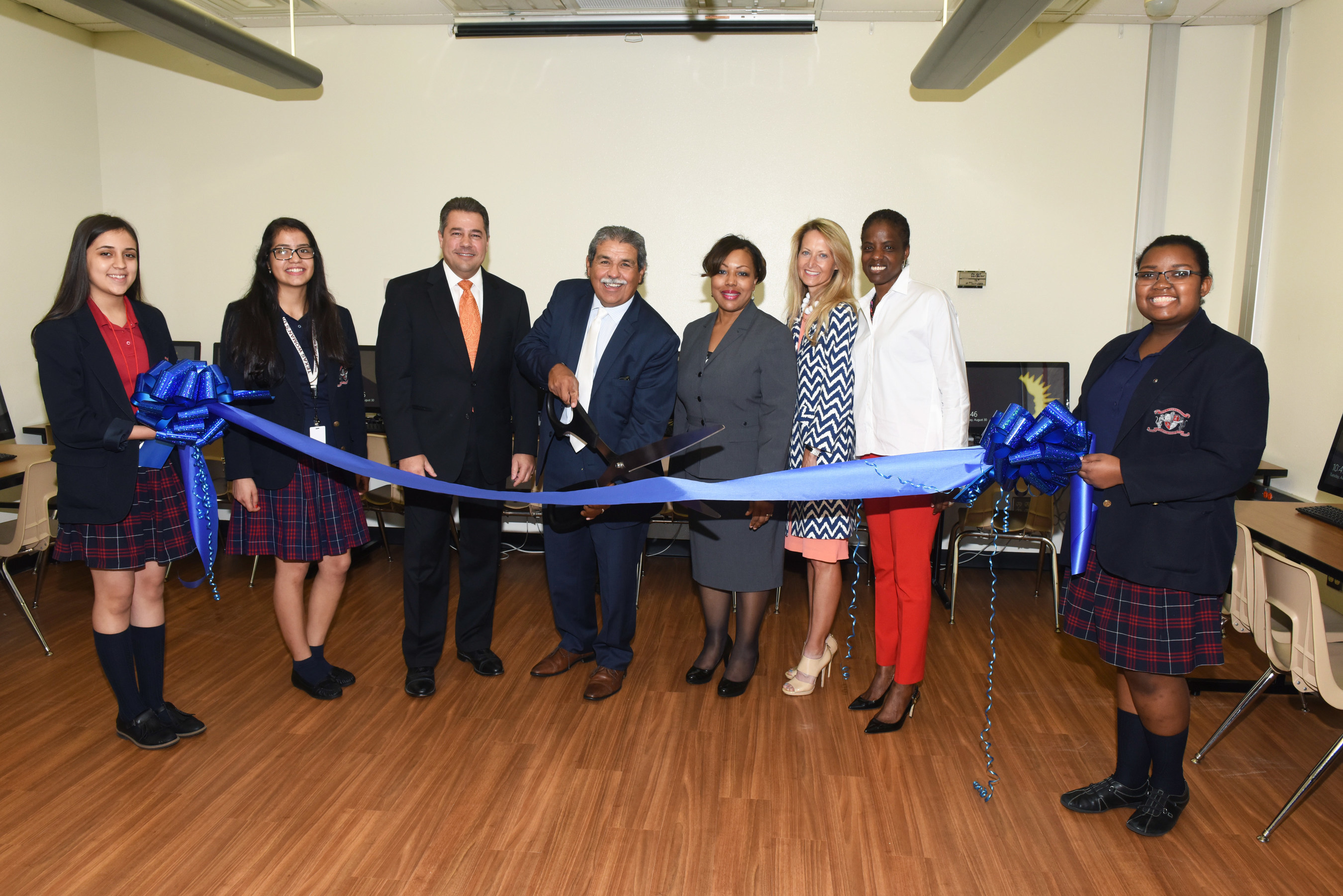 Young Women's Preparatory Network held a ribbon cutting this morning at its first member school, Irma Rangel, to thank NEC Foundation of America for its generous donation of the new computer lab and equipment. Pictured are Irma Rangel students along with Juan Fontanes, NEC Chief Information Officer (3rd from left); Dr. Michael Hinojosa, Dallas ISD Superintendent; Lisa Curry, Irma Rangel principal; Lynn McBee, Young Women's Preparatory Network CEO; Bernadette Nutall, Dallas ISD board trustee.