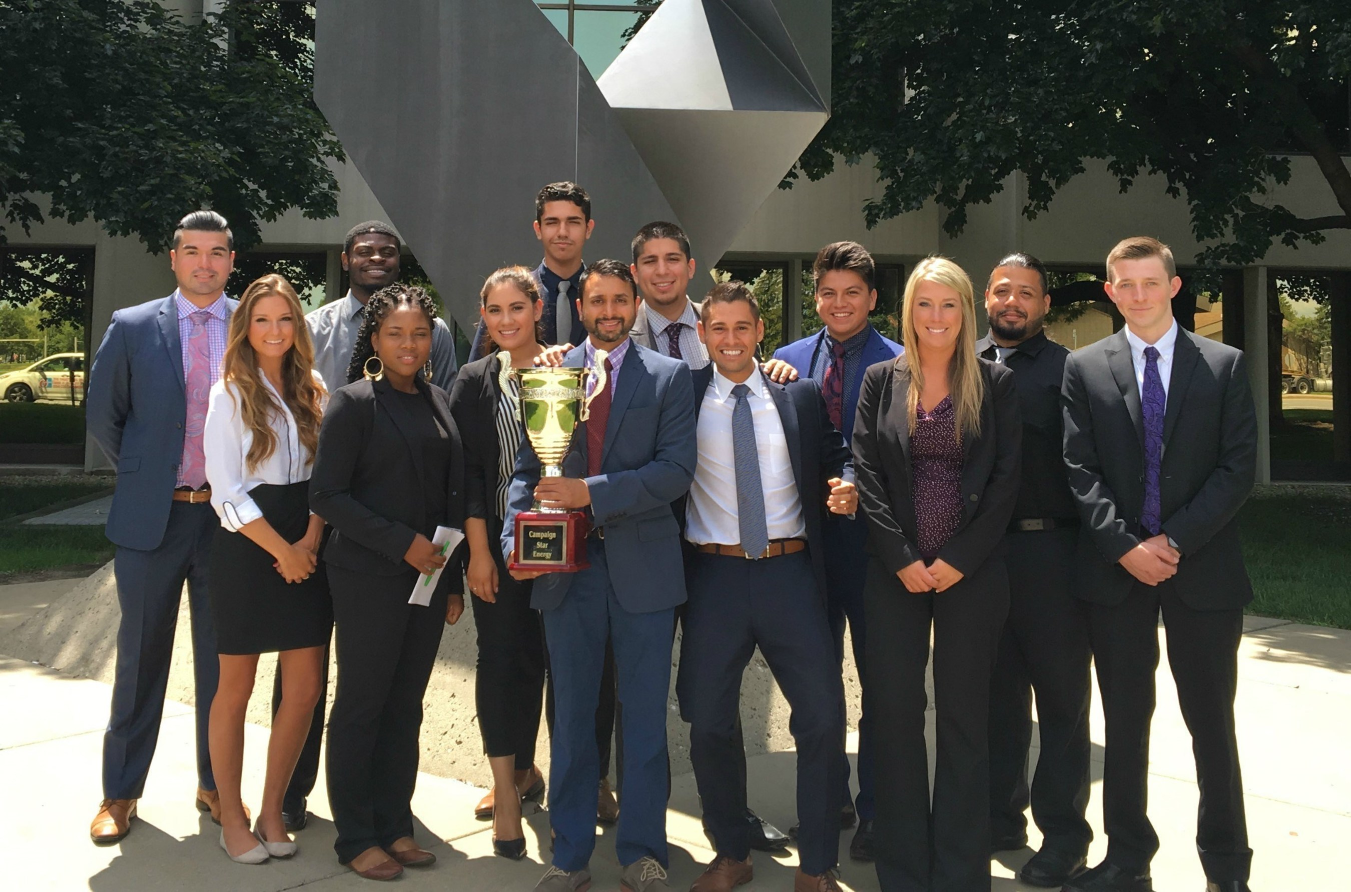 Marketing and consulting company One Chicago, Inc. received a national sales award for outstanding results on behalf of a prestigious energy client. President Juan Olmos and the One Chicago staff pose with the Campaign Cup trophy.