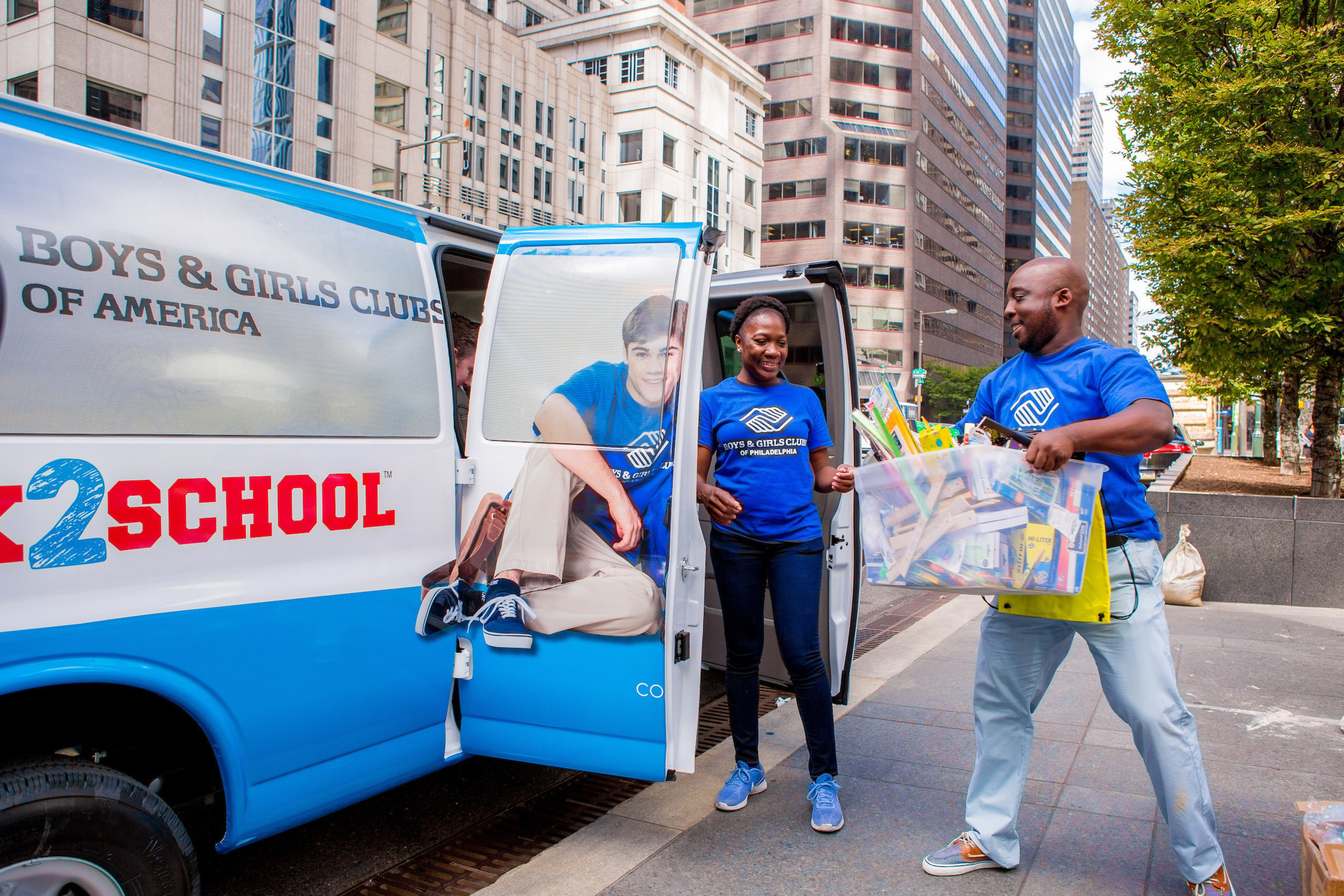 Boys & Girls Clubs of America and Comcast volunteers help Stuff the Bus during the organization's Back2School event.